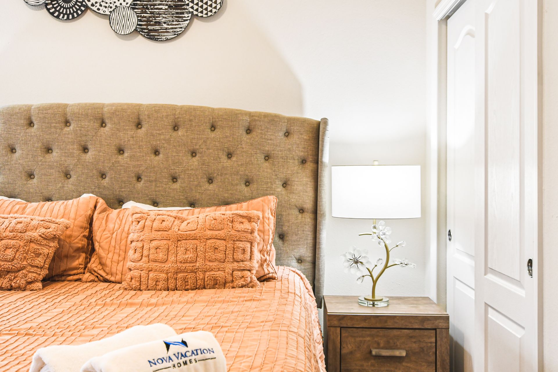 Elegant bedroom with warm tones and stylish accents for a luxurious, cozy retreat.