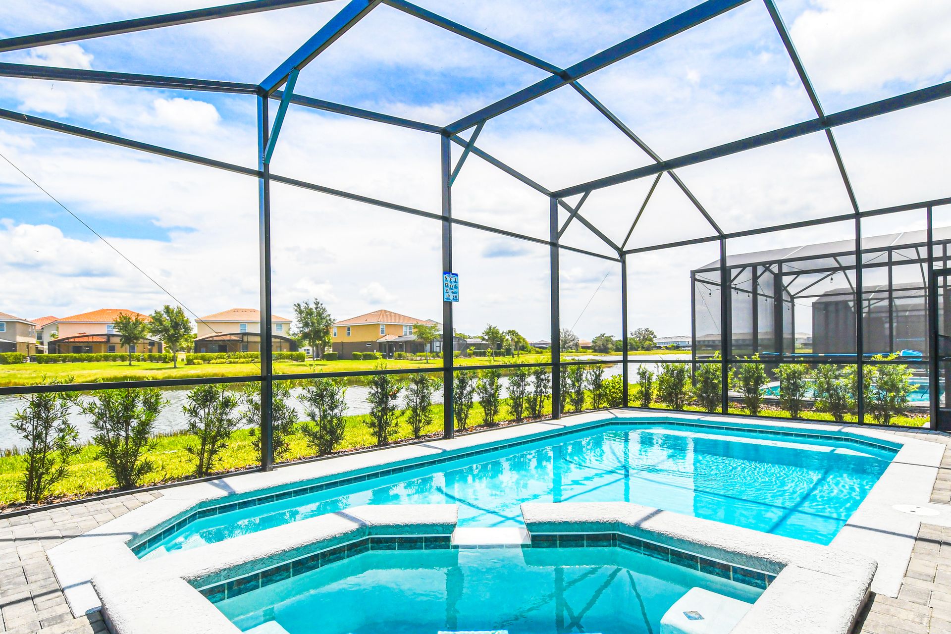 The beautiful lake view outdoor pool is a luxurious retreat for relaxation and entertainment. It features a large, heated swimming pool.
