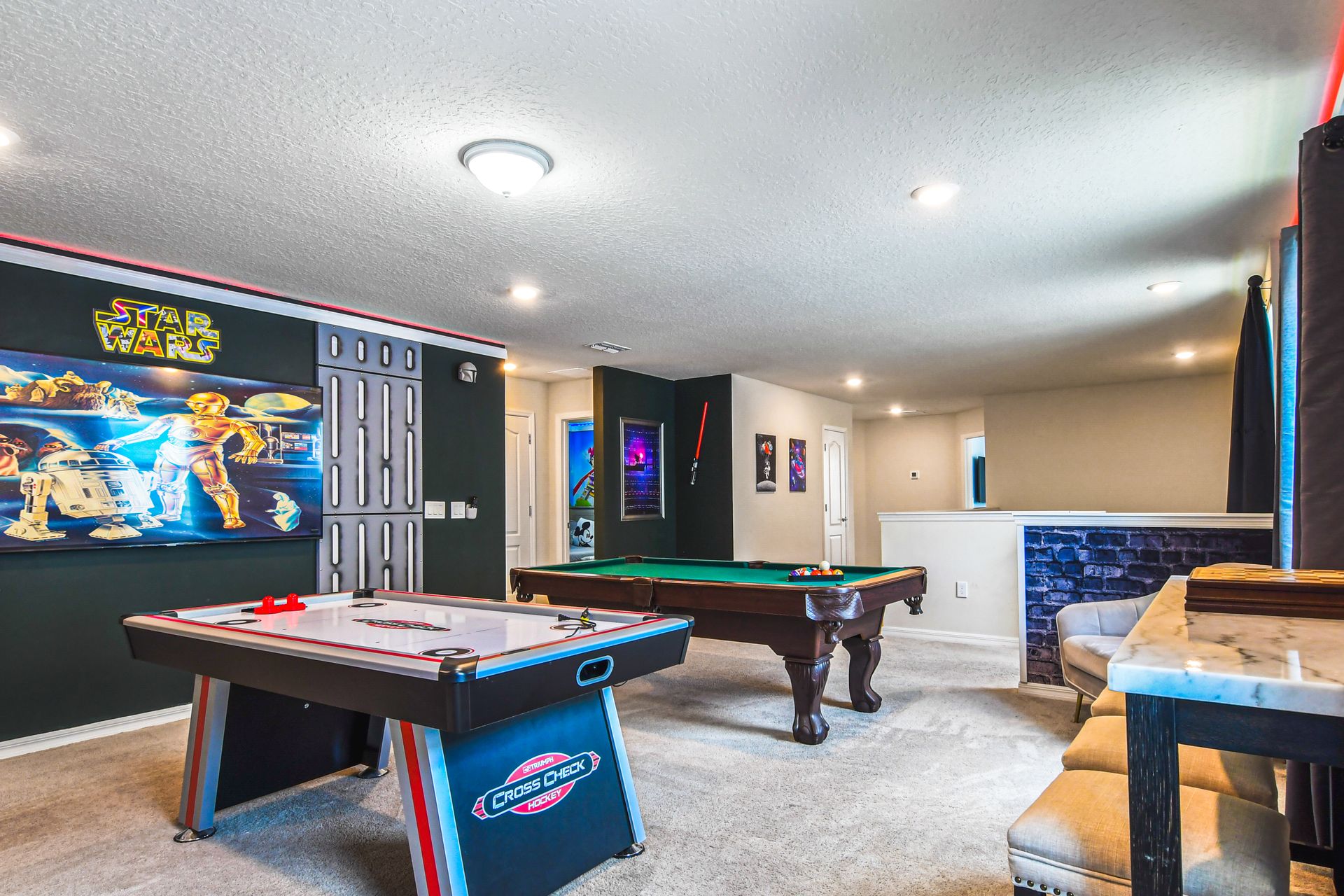 Ultimate fan cave with Star Wars decor and games galore—perfect for epic adventures and relaxation!