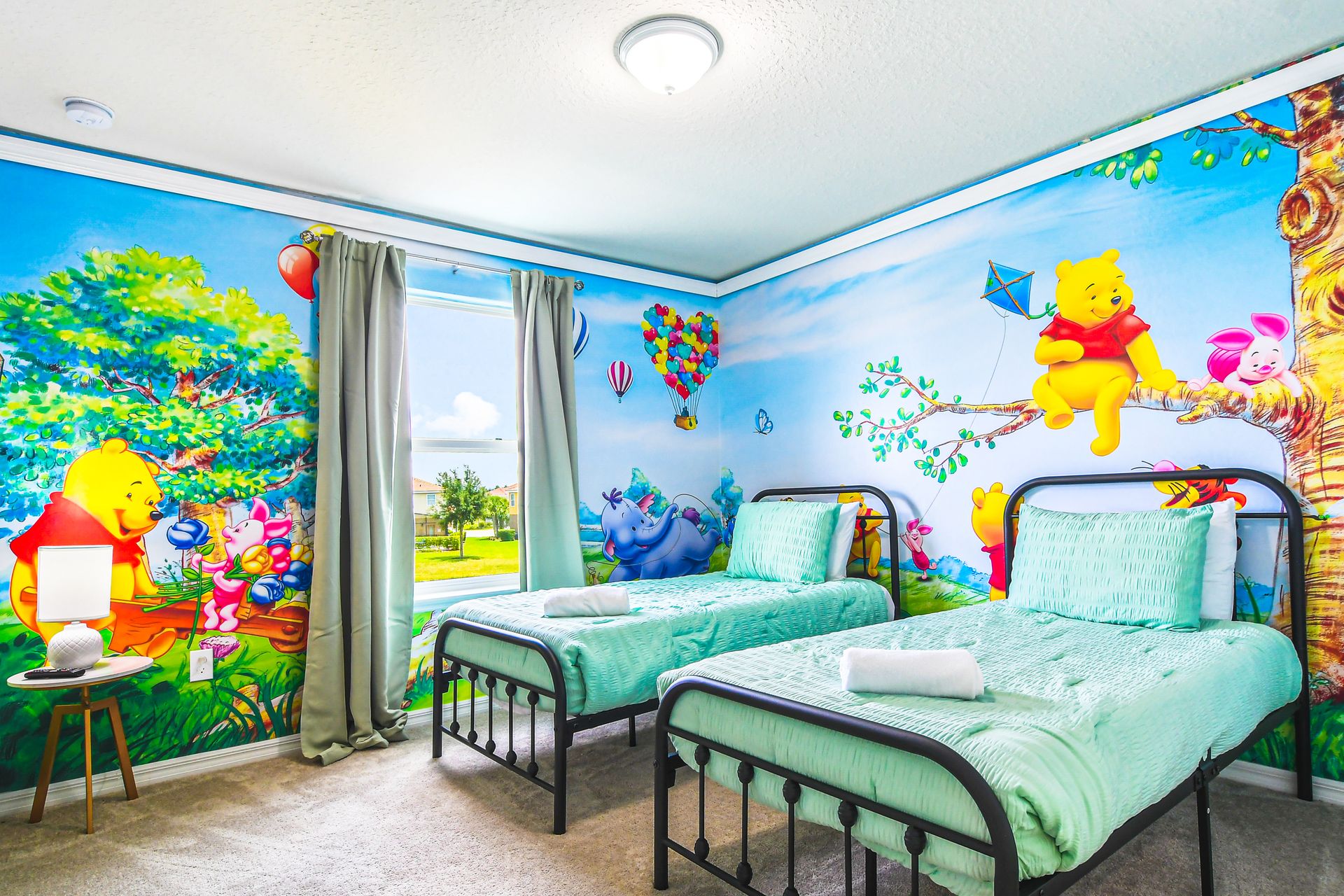 Joyful room with colorful Winnie the Pooh murals, perfect for sparking imagination and happy dreams in any child!