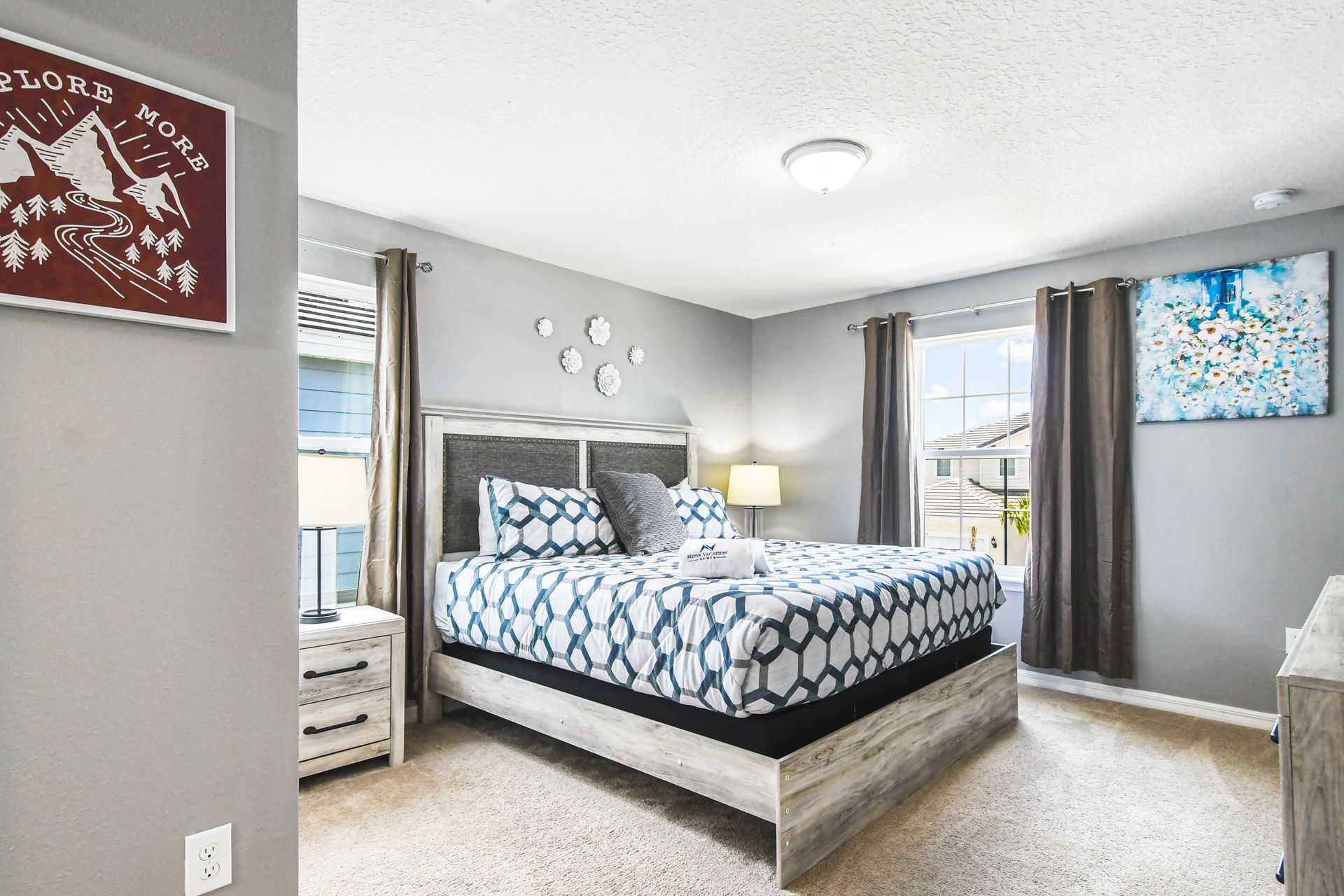 Stylish bedroom with adventurous decor invites tranquility and inspires dreams of exploring the great outdoors!