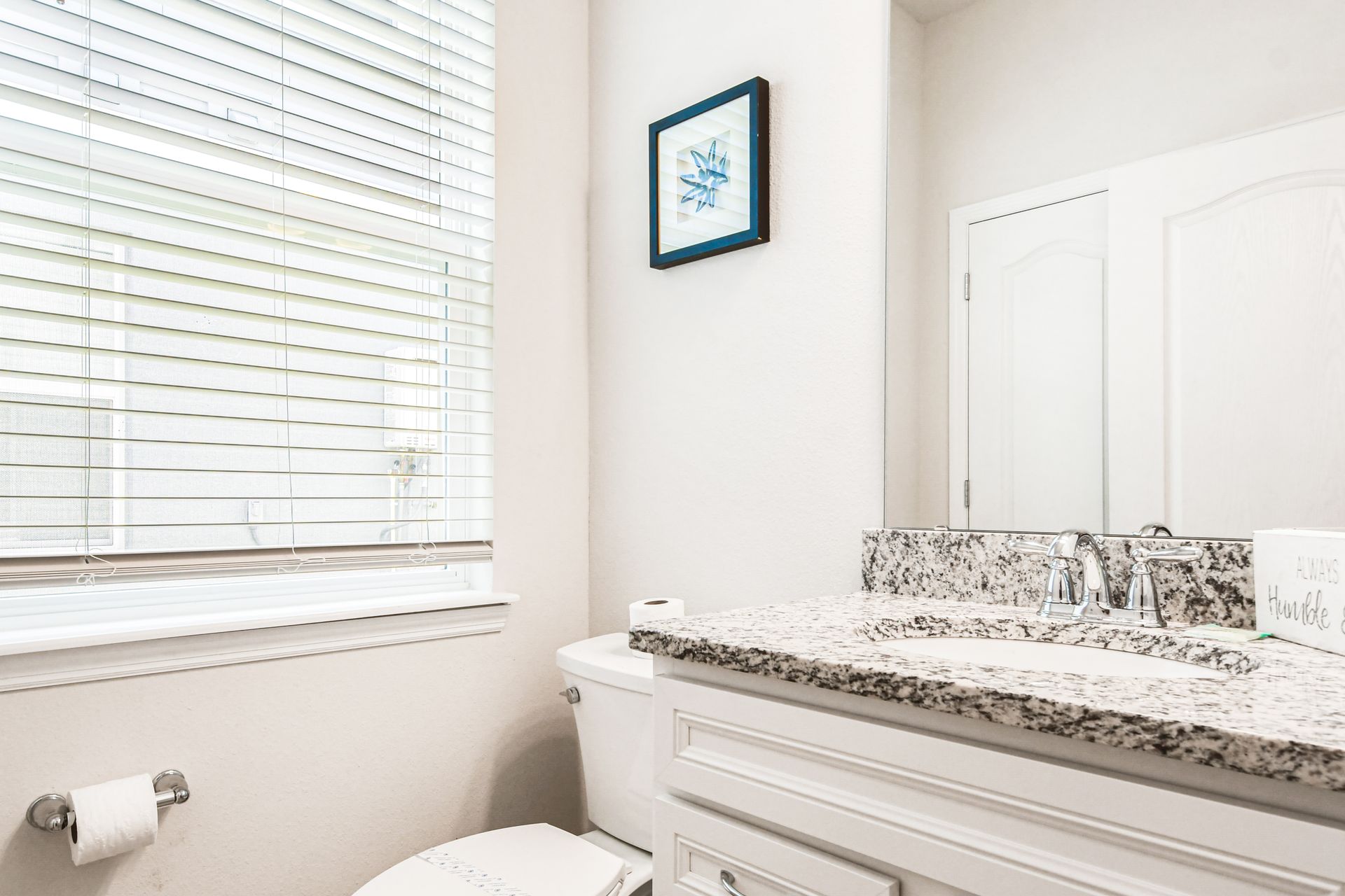 Bright, clean bathroom with elegant touches for a refreshing and uplifting start to the day!