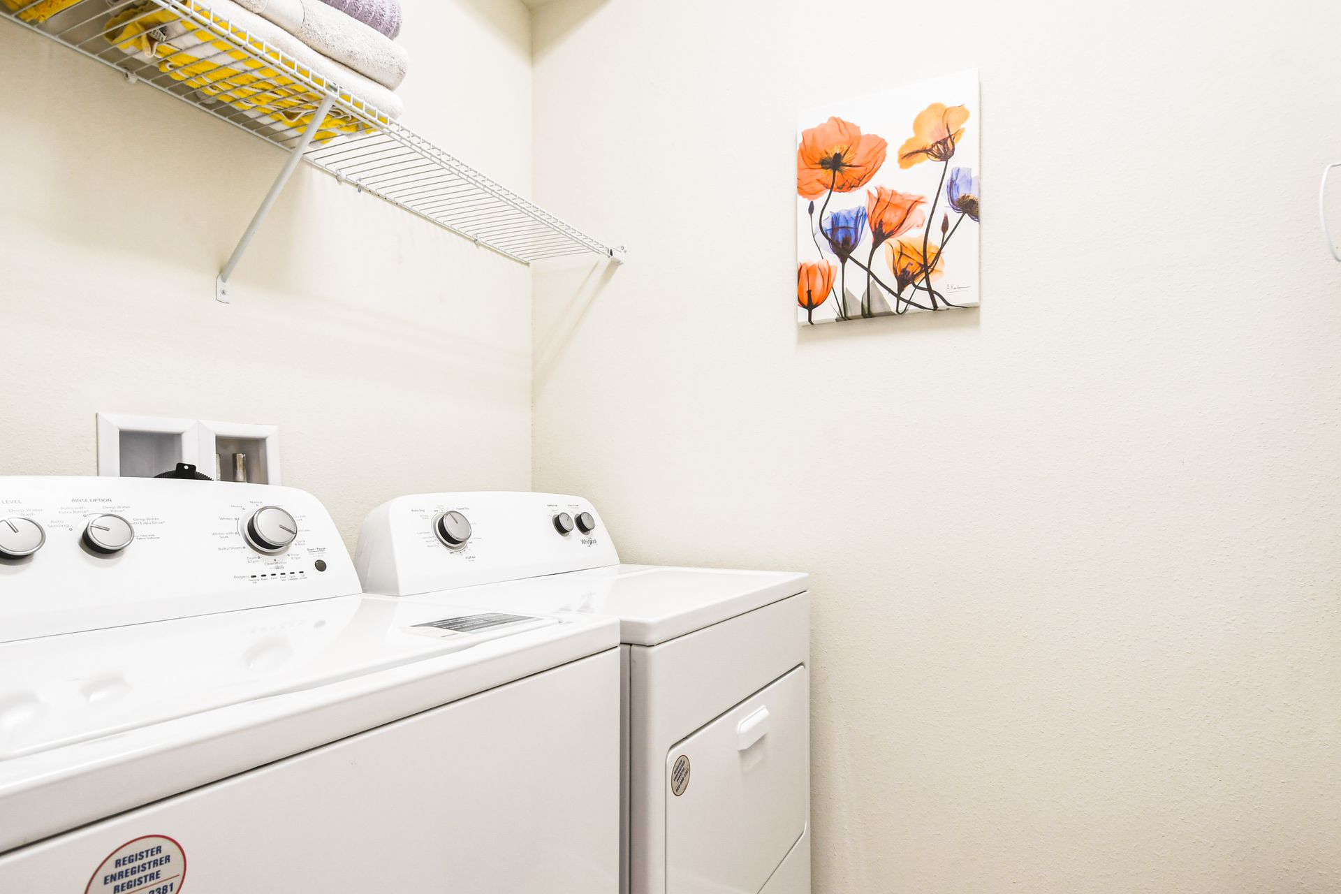 Efficient and compact laundry room equipped with everything you need to make washing day a breeze!