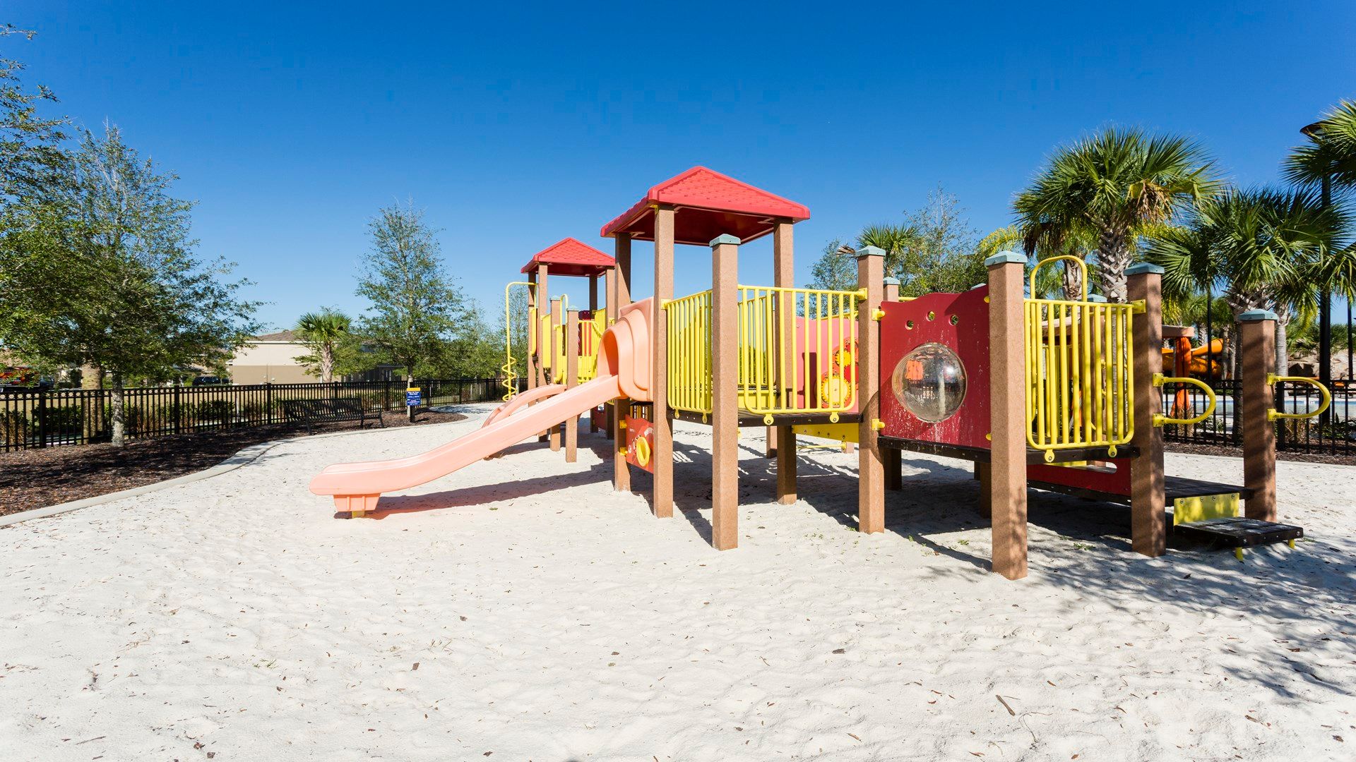 Sunny playground with swings awaits fun and laughter!