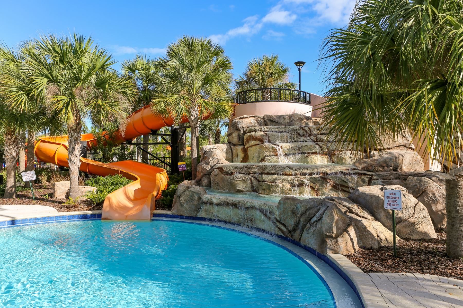 Kids' paradise! Resort's colorful water park with slides & games—splash into fun and adventure!