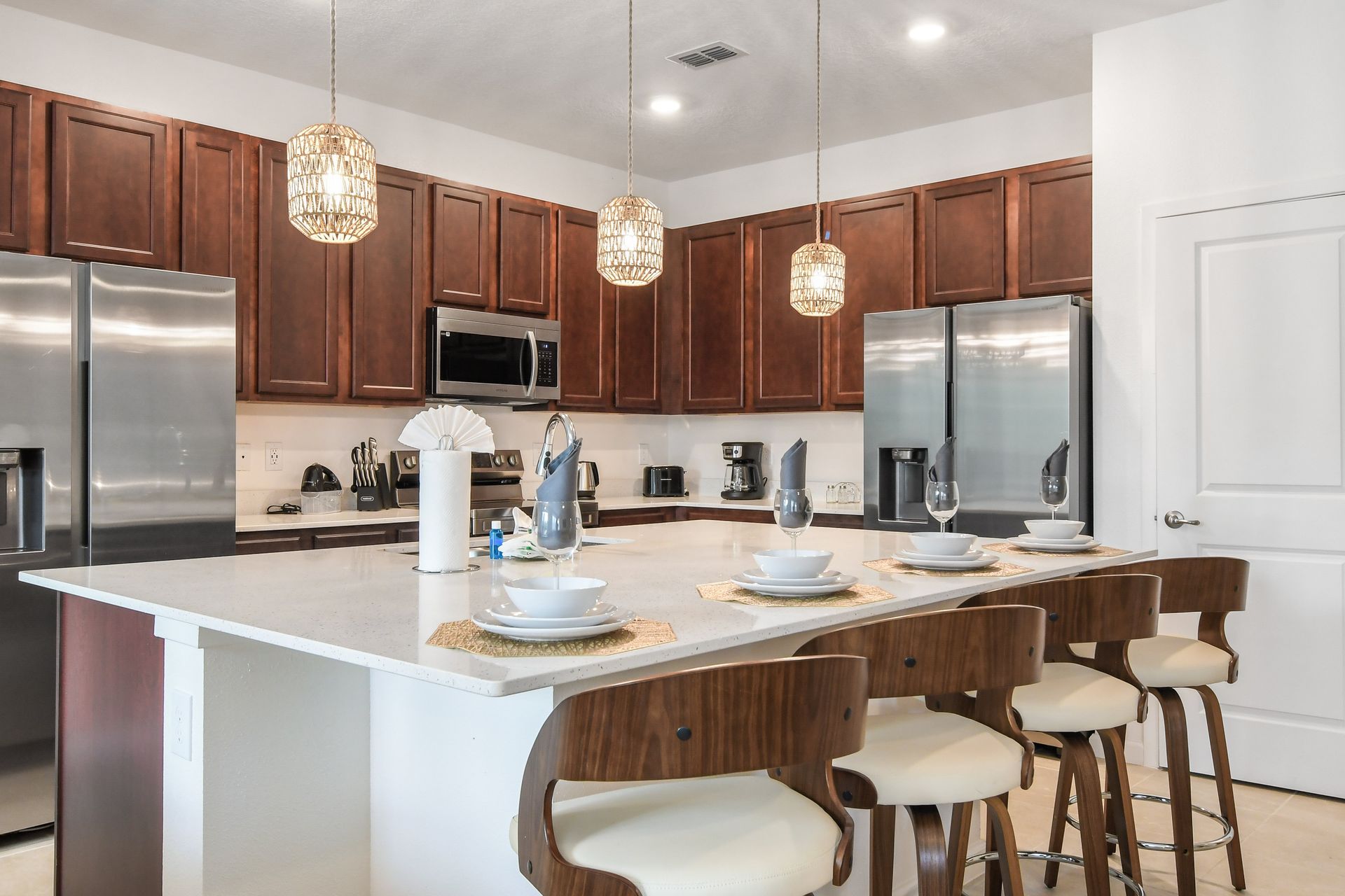 Kitchen with stainless steel appliances & island prep space
