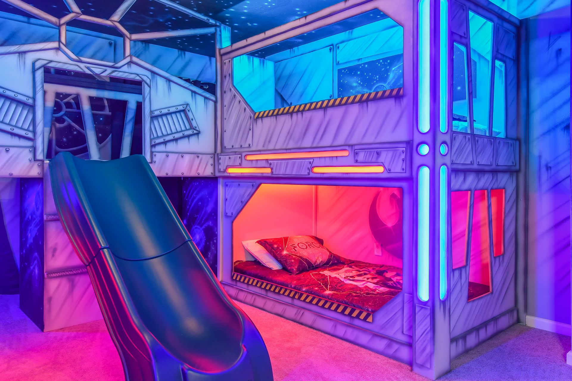 Bunk bed with slide in kid's room. Double the beds, double the fun.