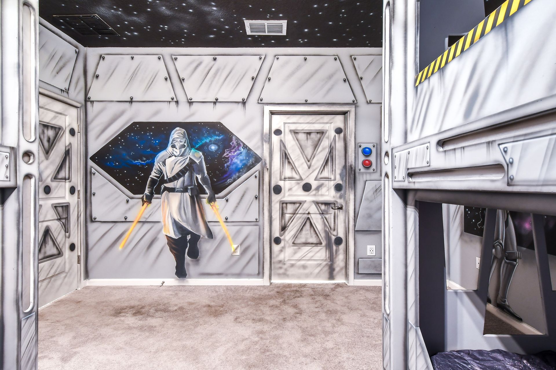 Immersive space-themed room with futuristic walls, galactic artwork, and bunk beds.