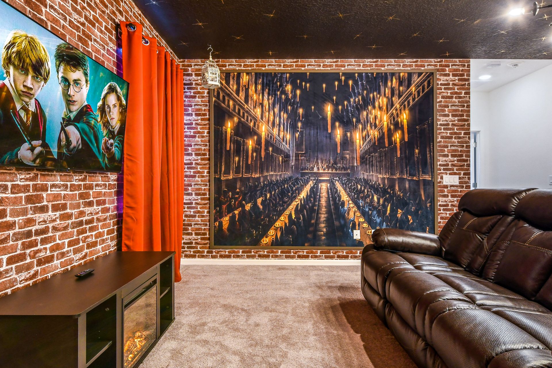Wizard-themed theater room with brick walls, magical decor, cozy seating, and warm lighting.