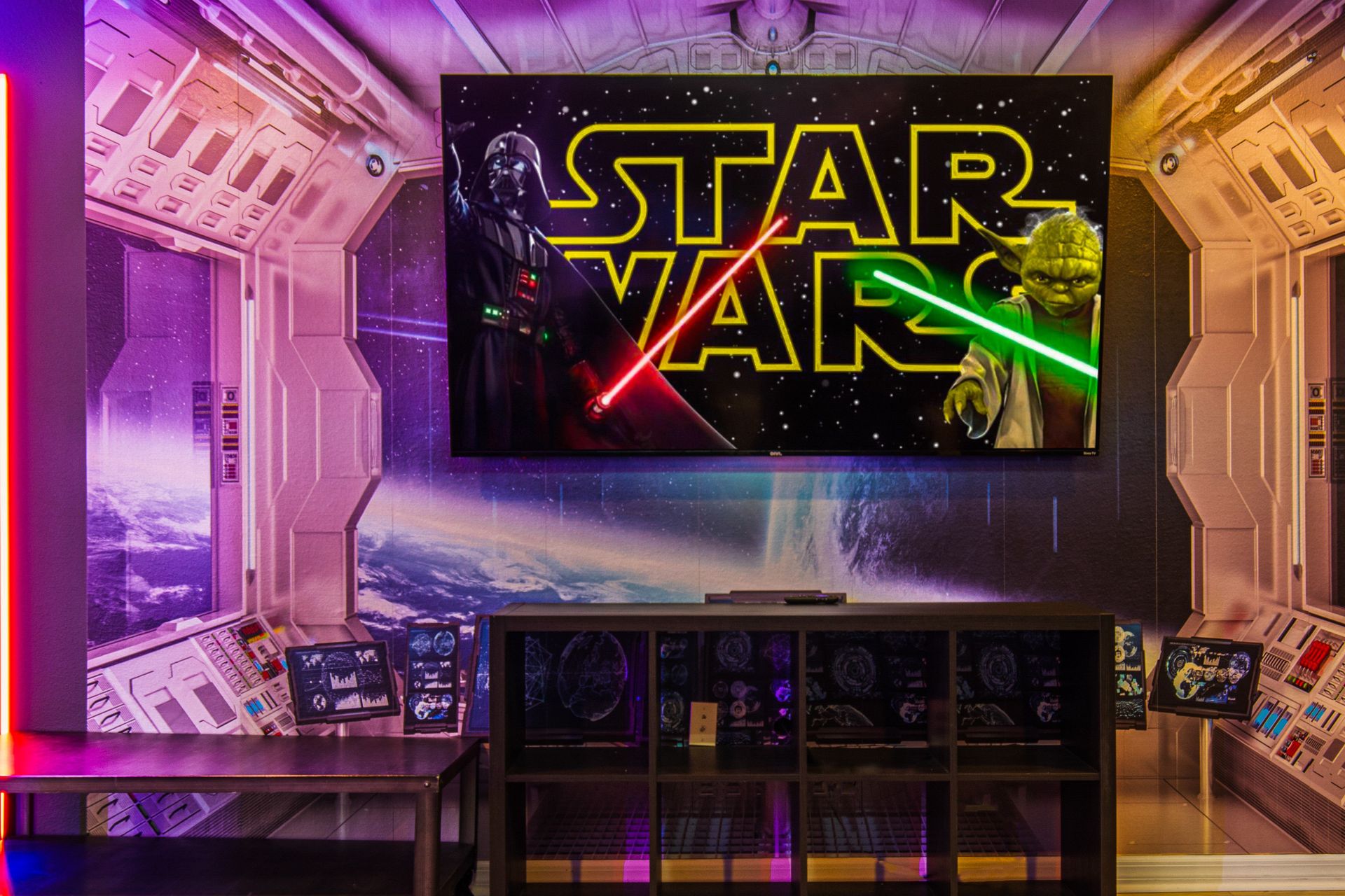 Epic Star Wars-themed theater with immersive decor, neon lighting, and a big screen!