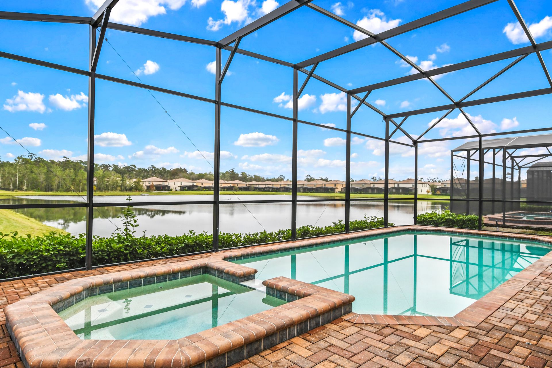 Screened Pool & Spa: Enjoy a private oasis with a screened pool and spa for a serene and refreshing retreat