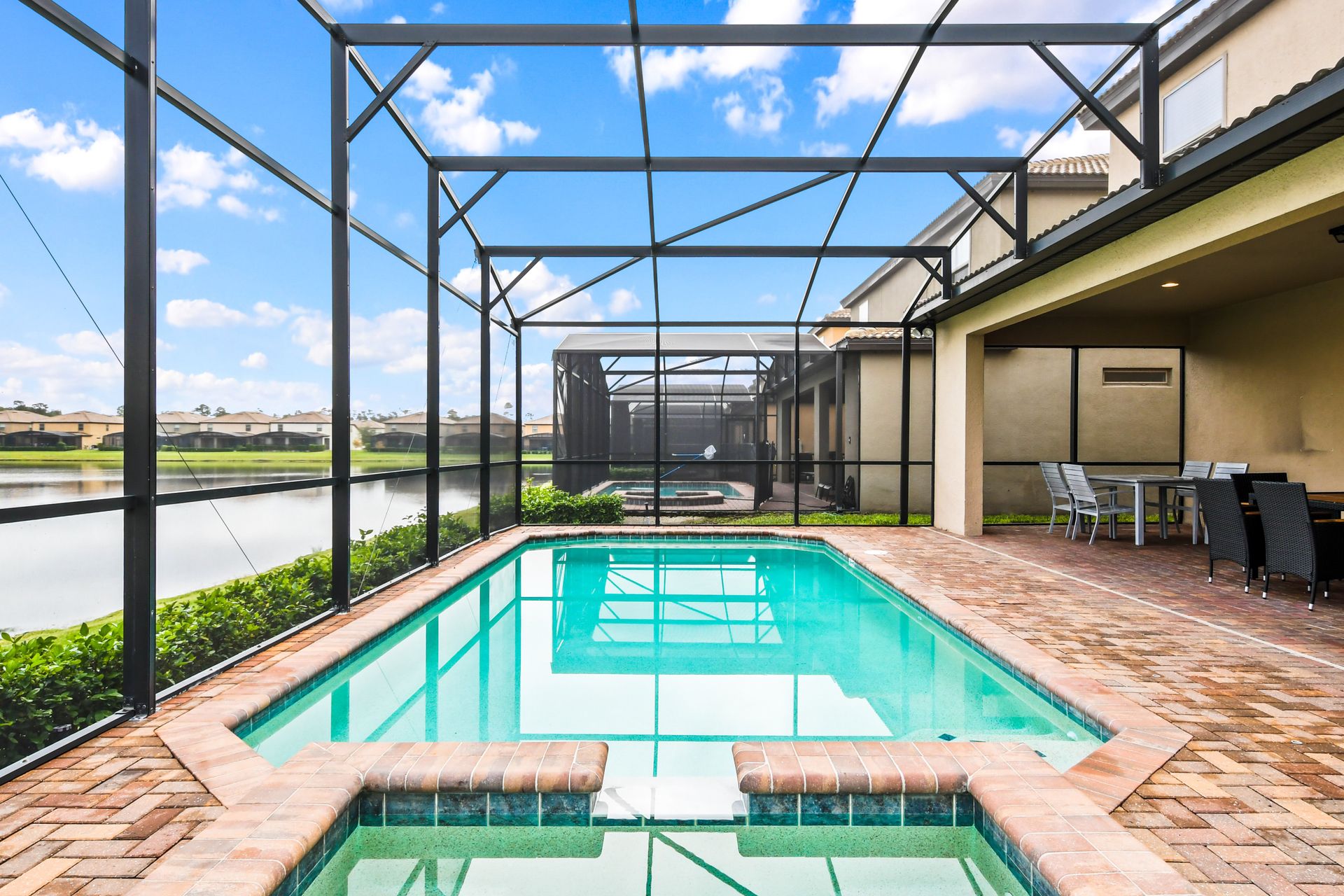 Screened Pool & Spa: Enjoy a private oasis with a screened pool and spa for a serene and refreshing retreat