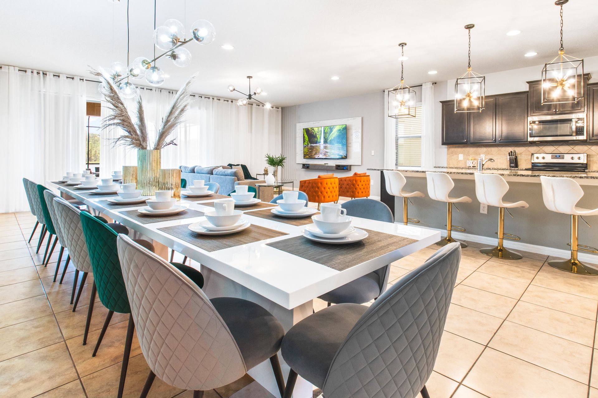 Spacious open-concept dining and kitchen area with elegant decor and seating for all!