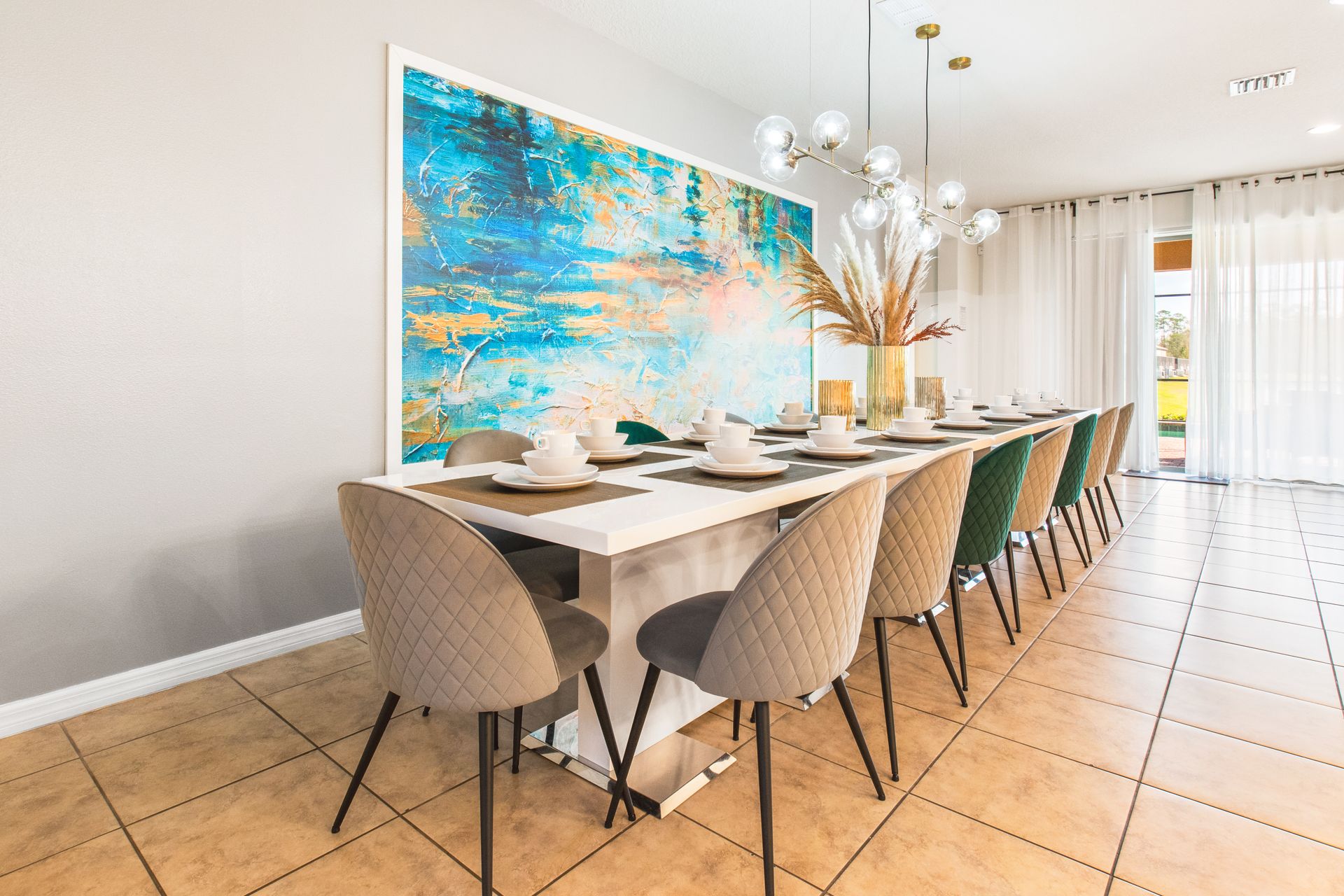 Elegant dining space with seating for 12, modern decor, and vibrant artwork!