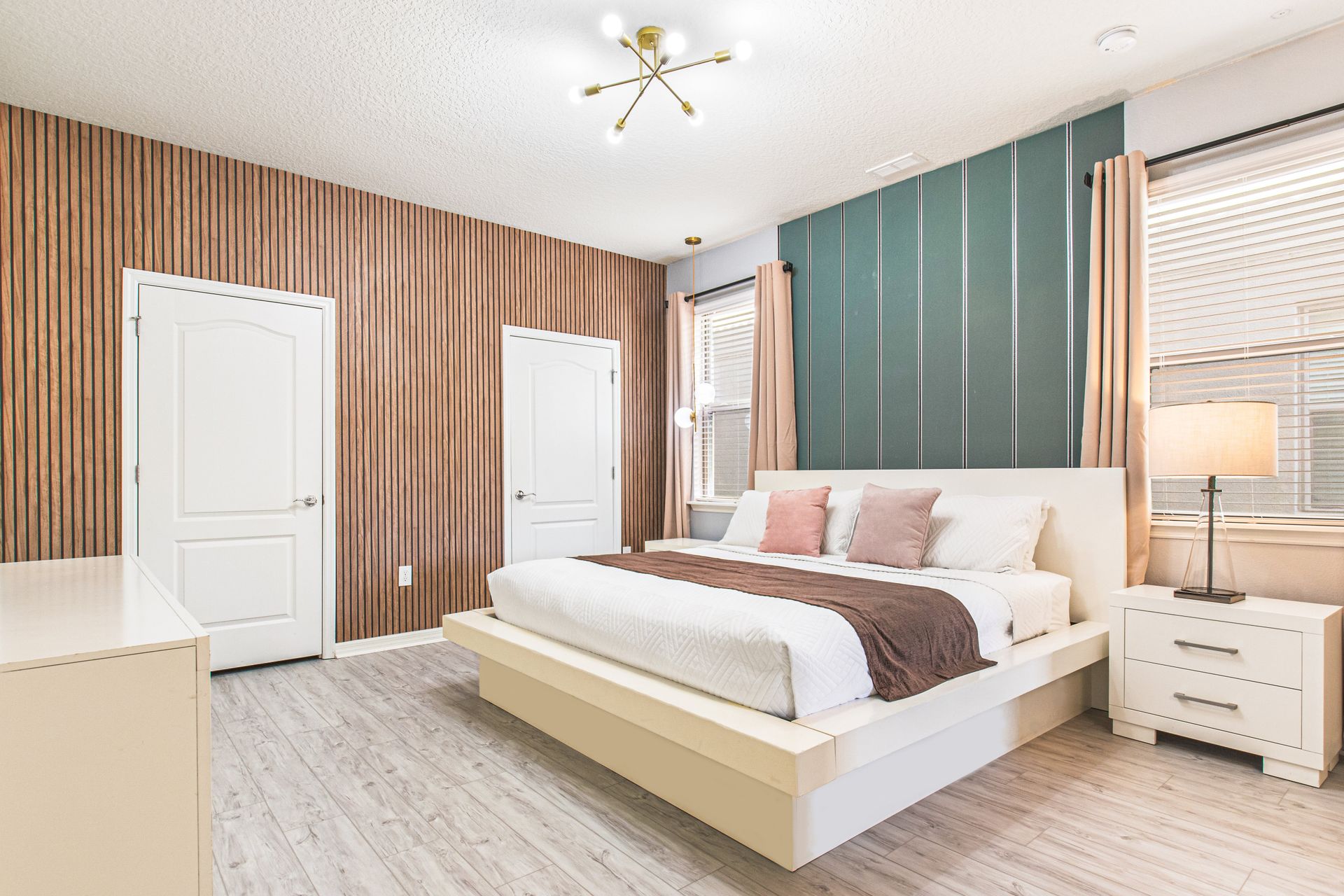 Stylish modern bedroom with warm wood accents, elegant lighting, and cozy vibes!