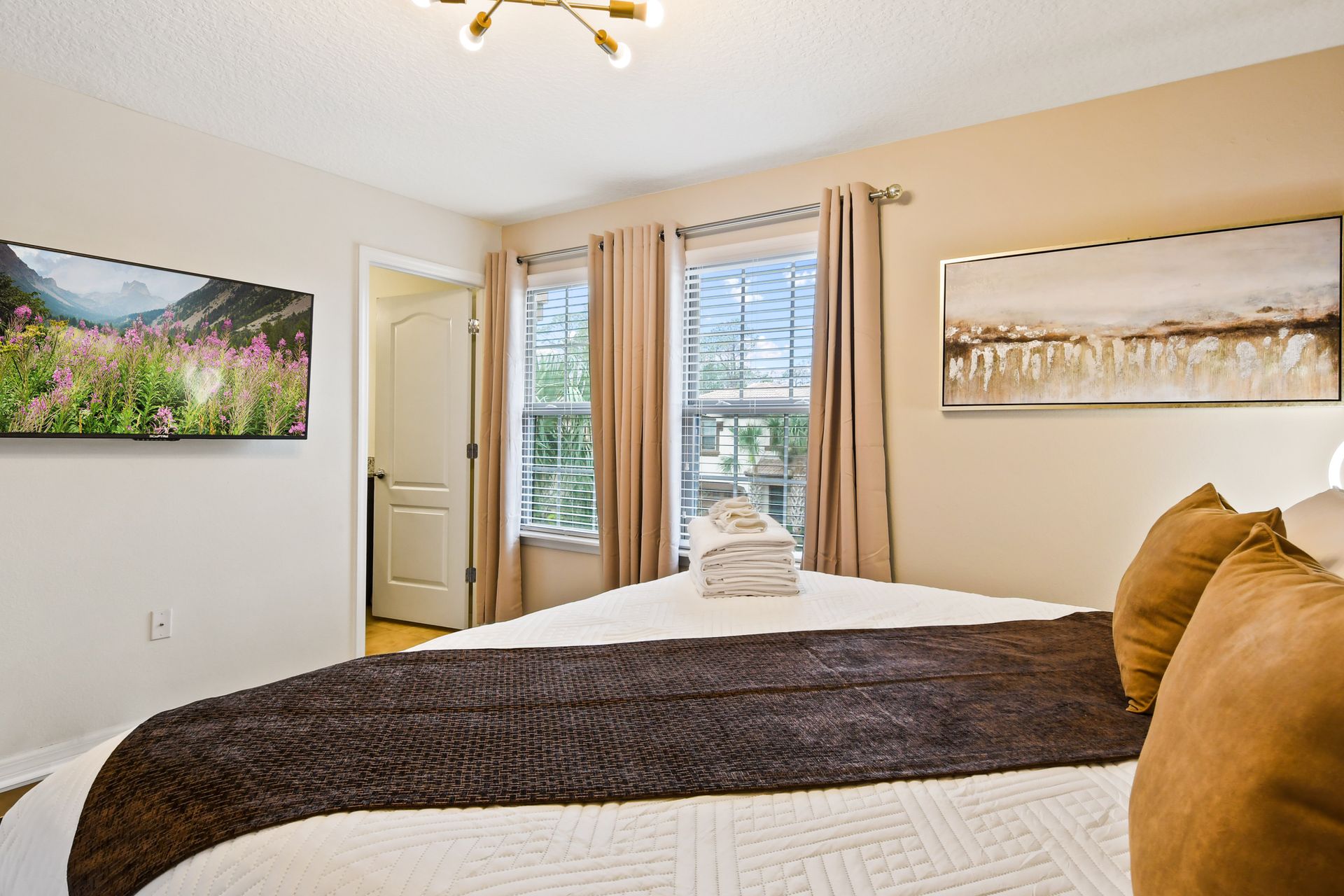 Cozy and stylish bedroom with warm tones, modern decor, and a relaxing ambiance!