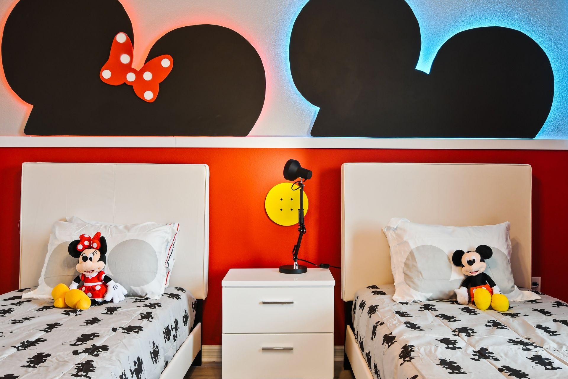 Magical Mickey & Minnie-themed bedroom with twin beds, fun decor, and cozy vibes!