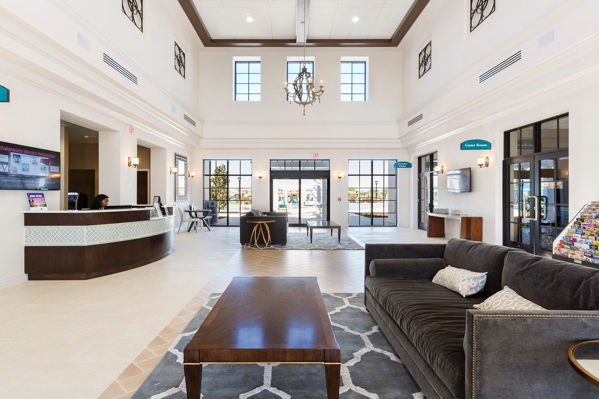 Grand clubhouse lobby with high ceilings, cozy seating, and concierge service for a welcoming arrival.