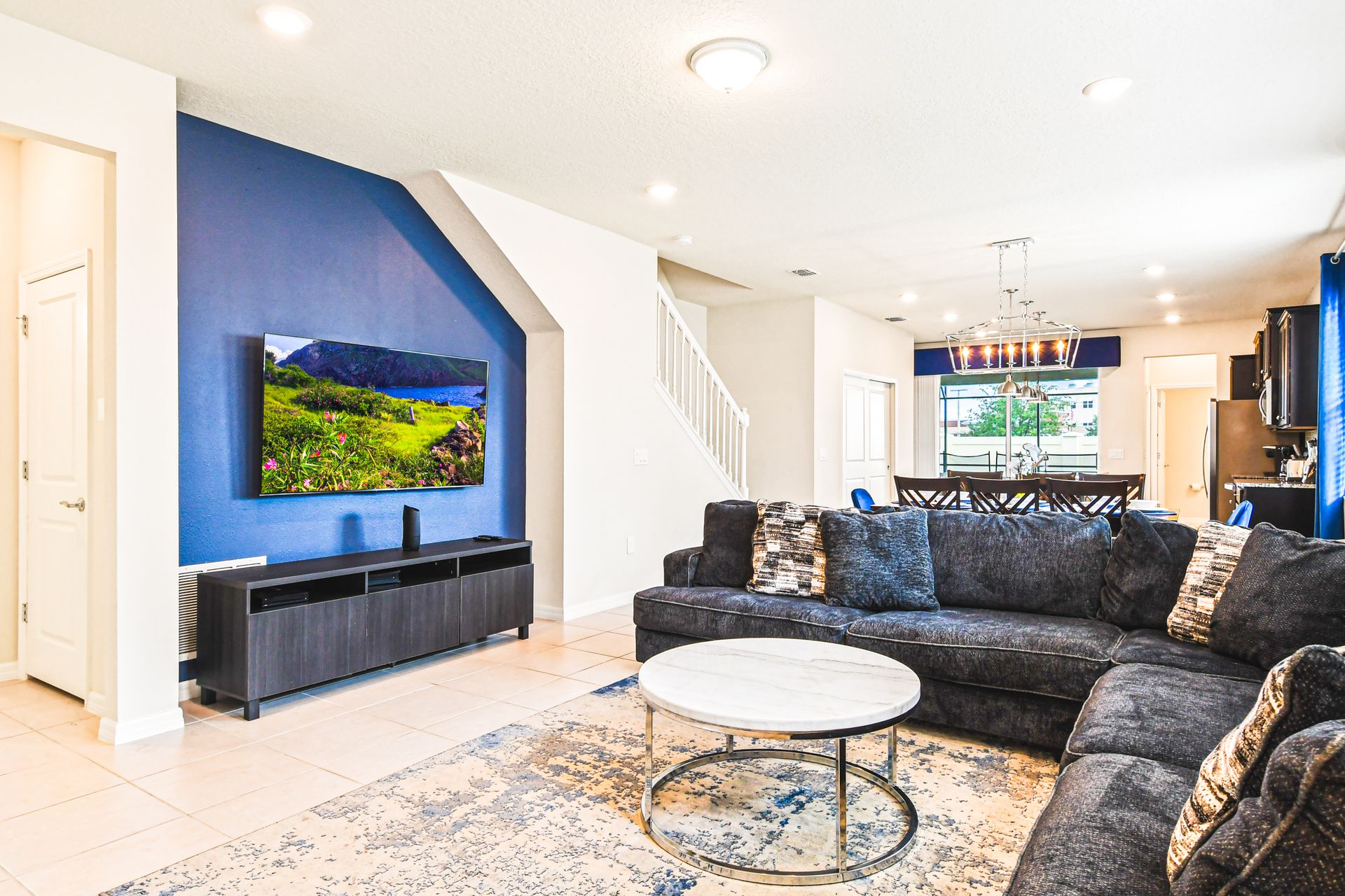 Enjoy quality time with loved ones in our inviting living room, offering a cozy space for relaxation.