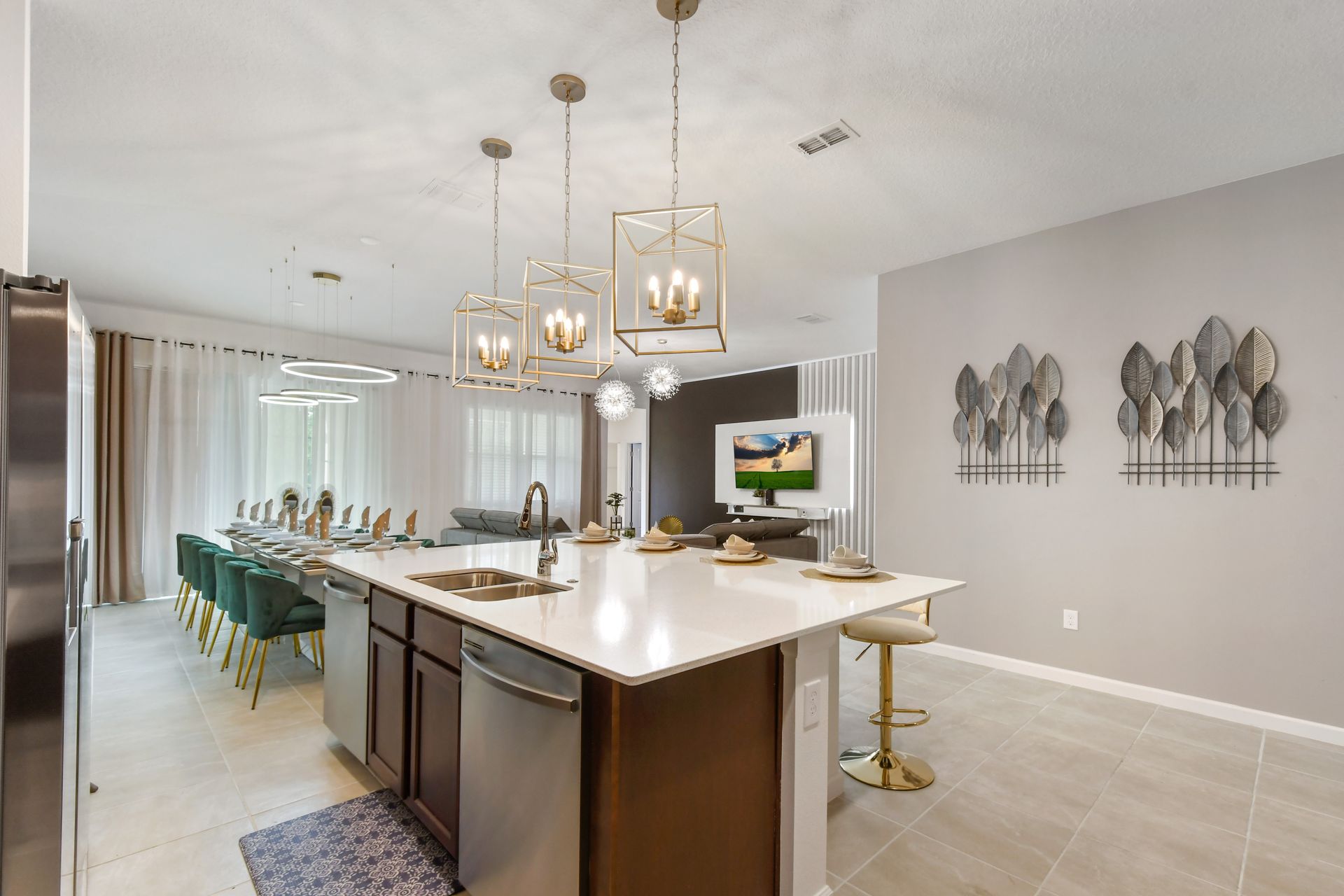 Bright, modern kitchen with island seating, elegant décor, and open living flow.
