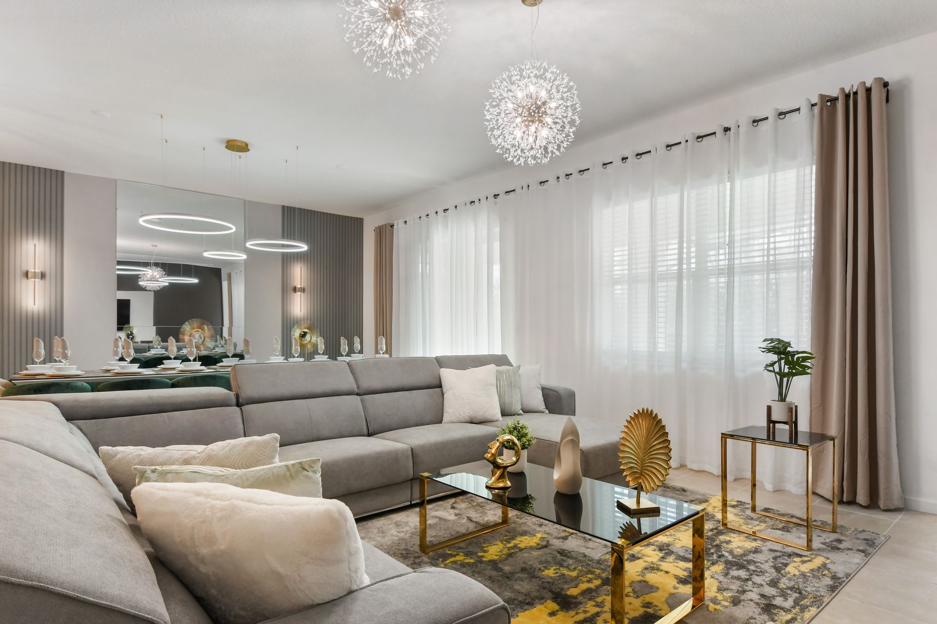 Spacious modern retreat with chic decor, cozy seating, and elegant lighting.
