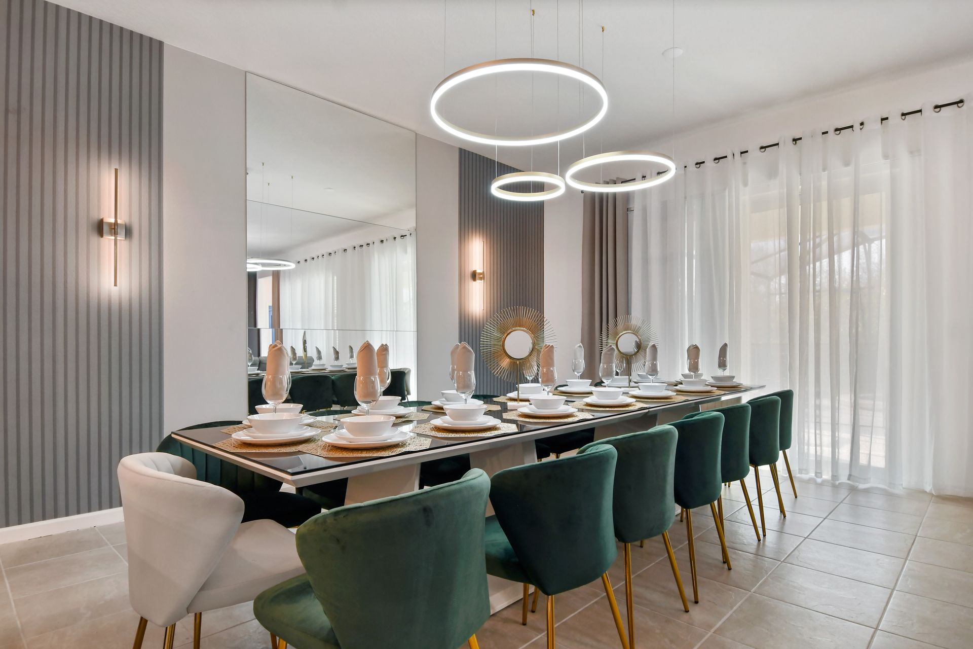 Host a memorable dinner in this sophisticated dining space featuring a sleek table and plush chairs that seat up to 30 guests.