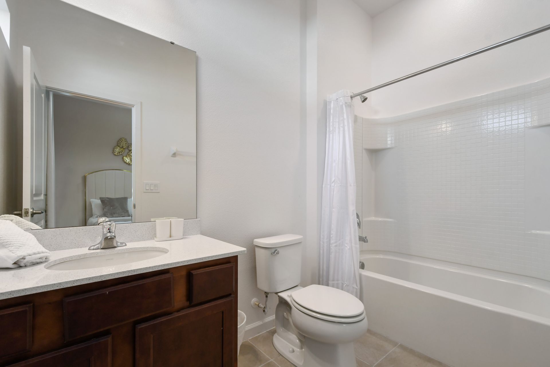 Clean and modern bathroom with bright lighting, full tub, and elegant finishes.
