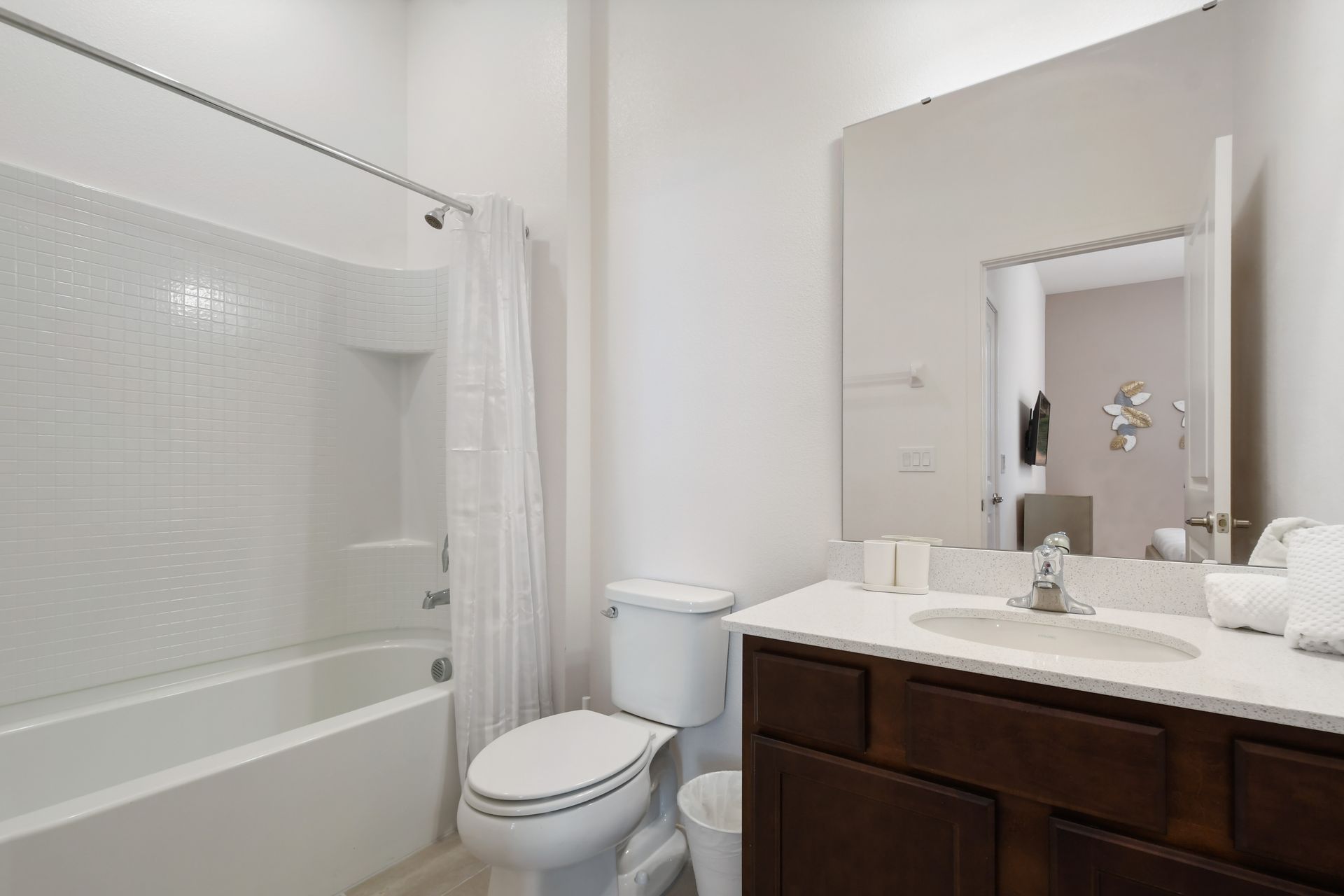 Clean and modern bathroom with bright lighting, full tub, and elegant finishes.
