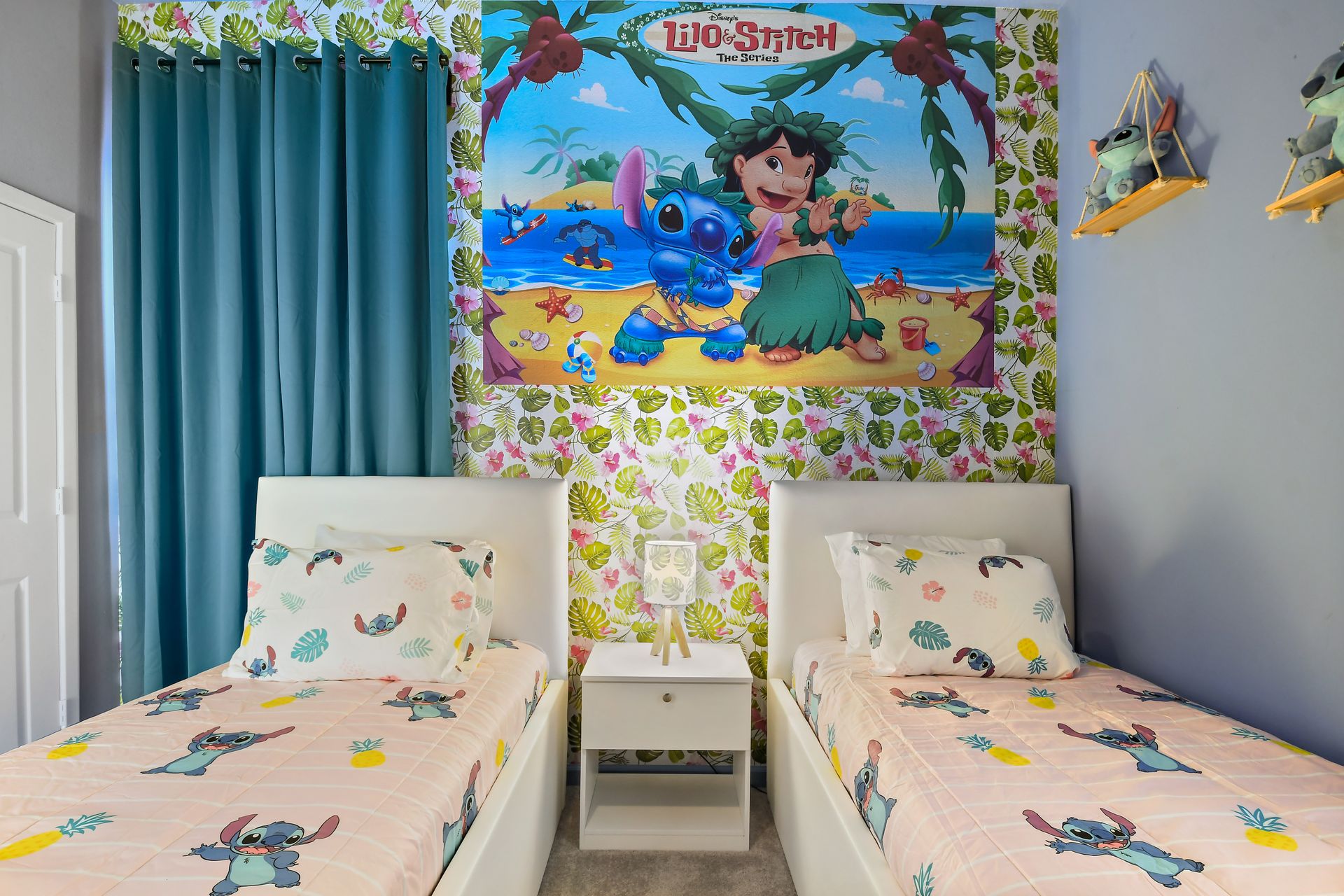 Tropical-themed kids’ room with twin beds, playful decor, and island vibes.
