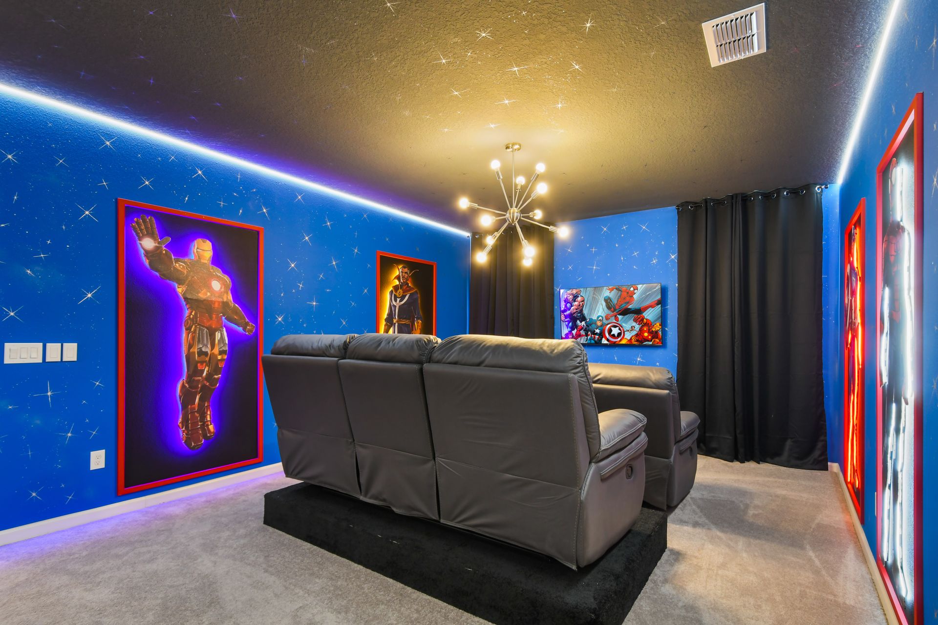 Hero-themed home theater with cozy recliners, starry walls, and epic style.
