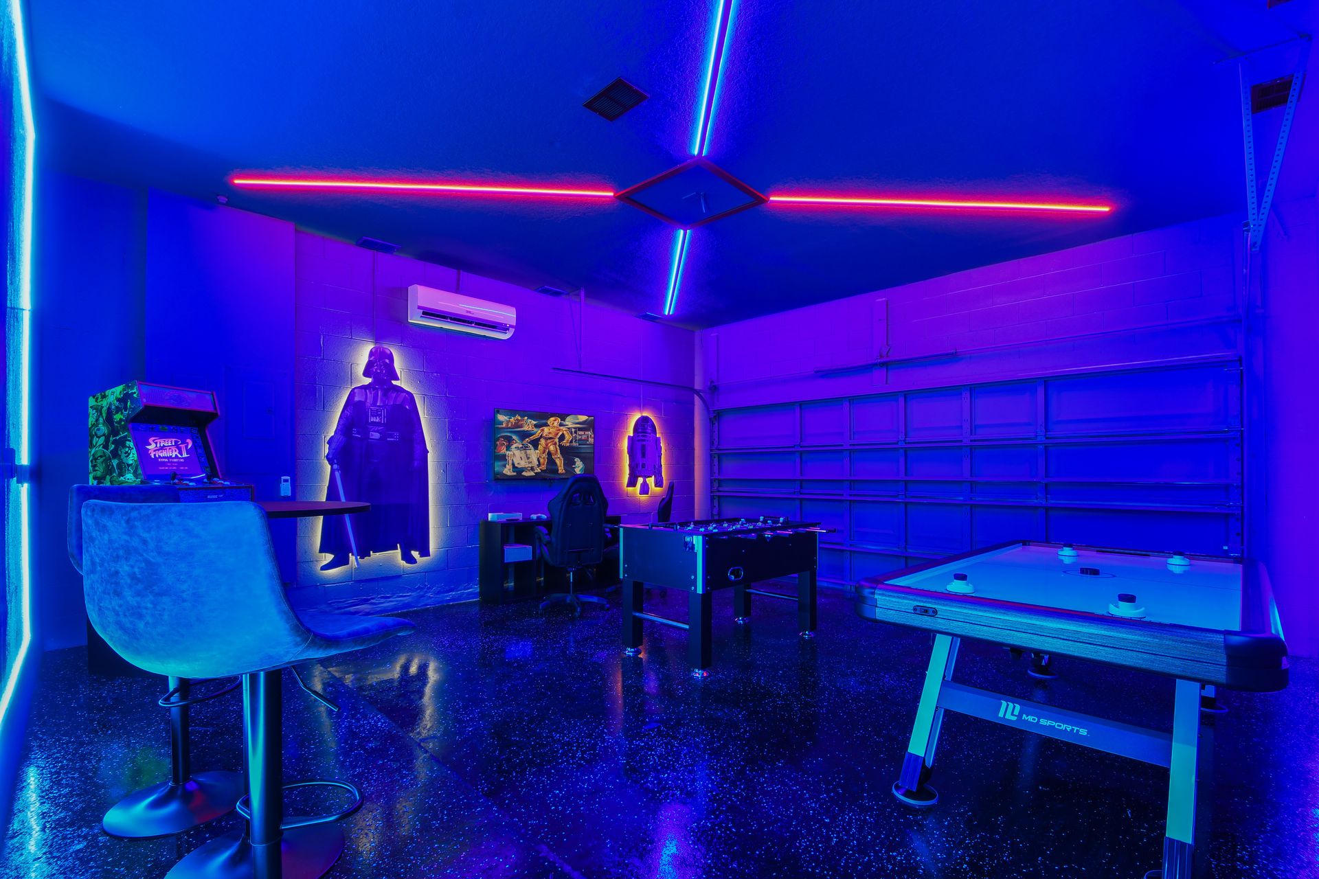 Immersive Star Wars game room with foosball, arcade action, and neon glow.
