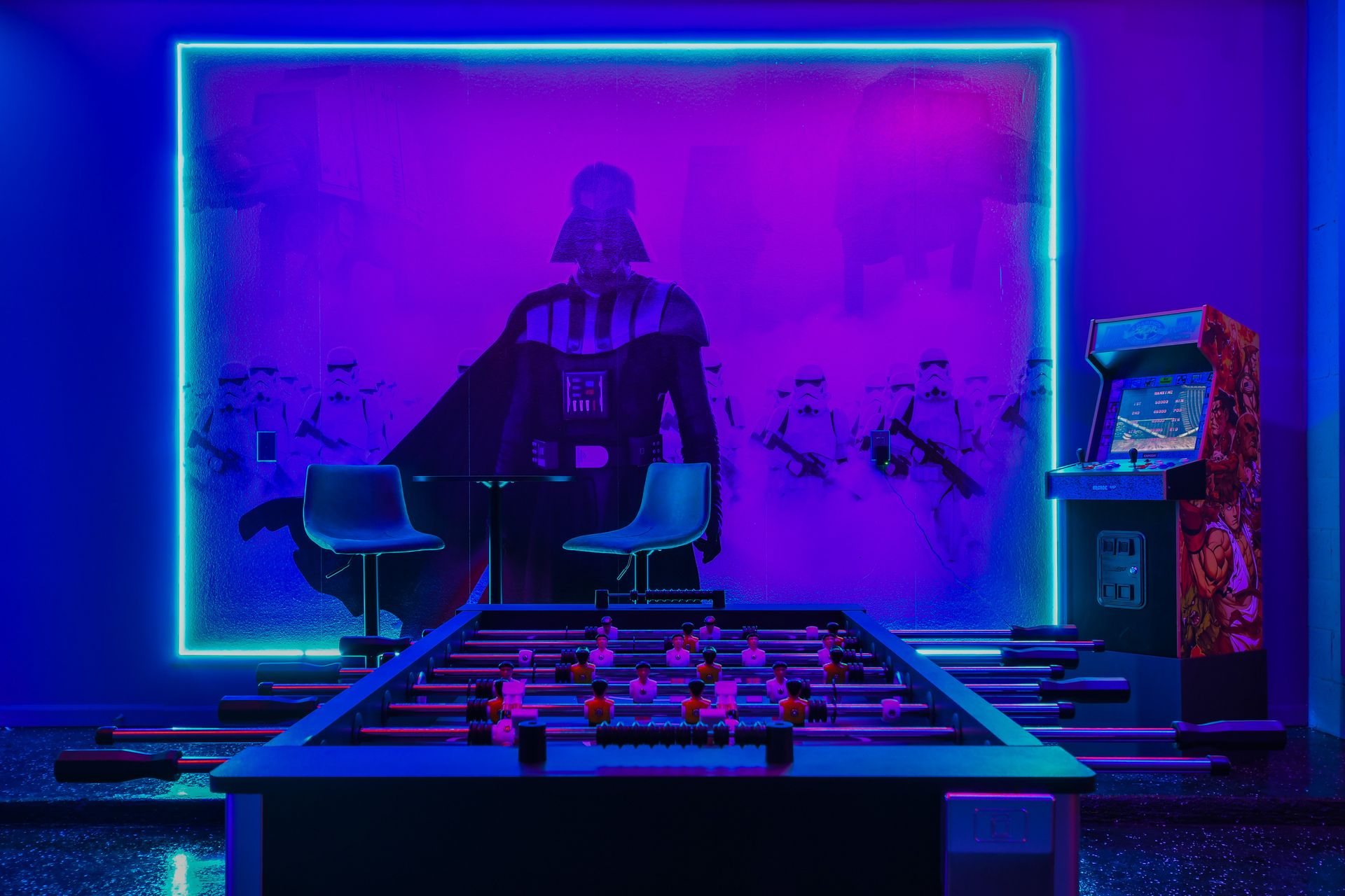 Immersive Star Wars game room with foosball, arcade action, and neon glow.
