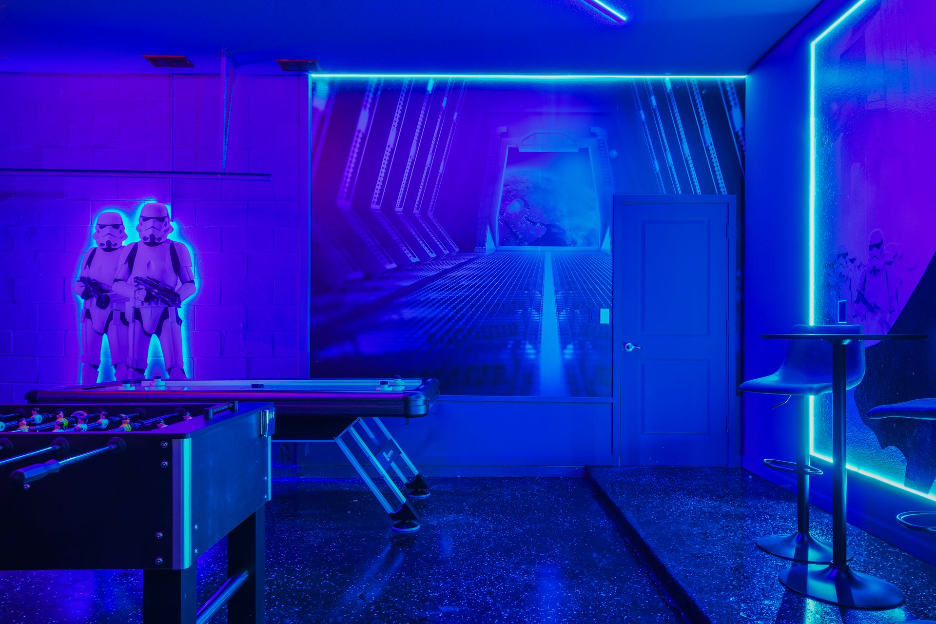 Immersive Star Wars game room with foosball, arcade action, and neon glow.
