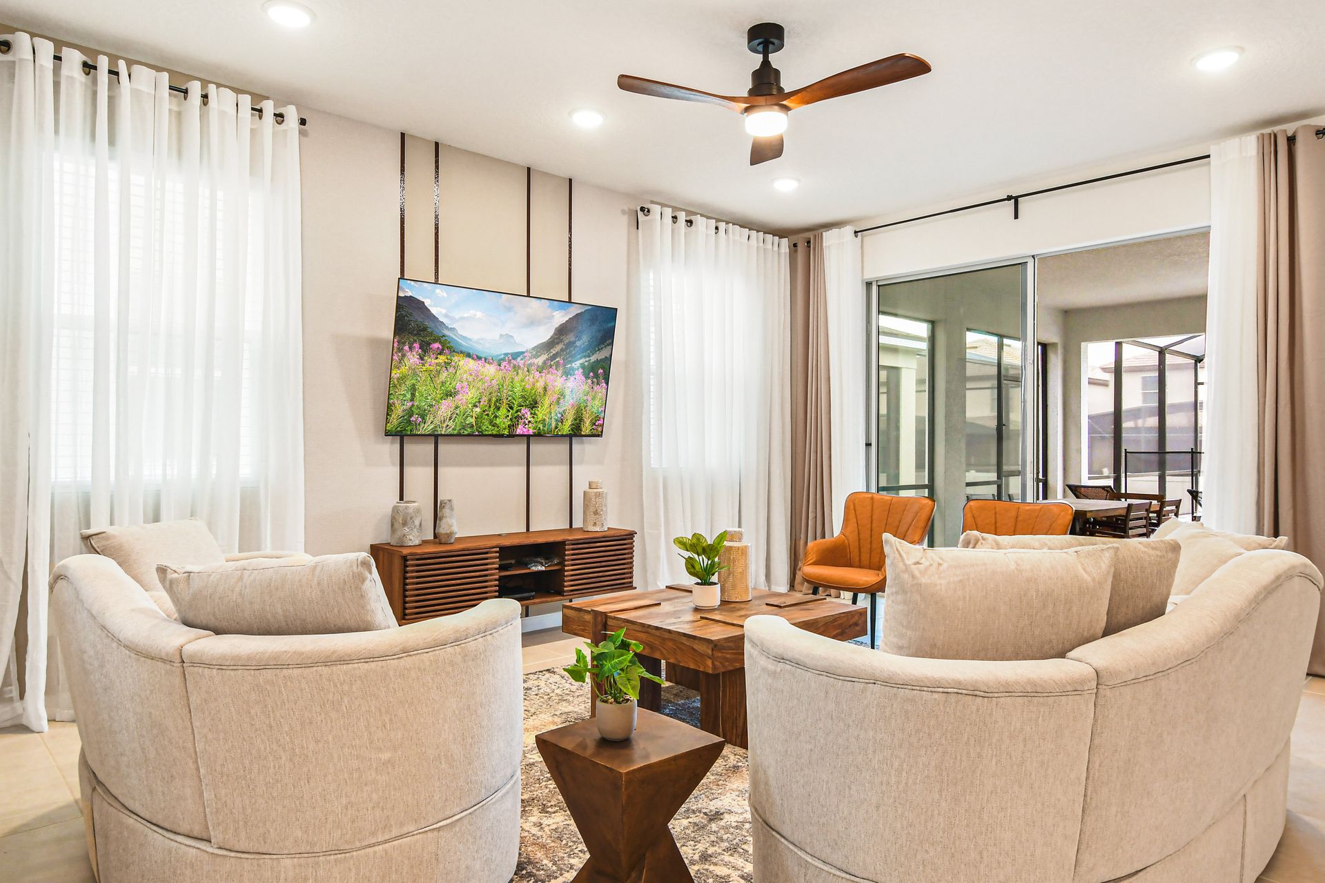 Bright and modern living space with cozy seating and a view to the private patio.