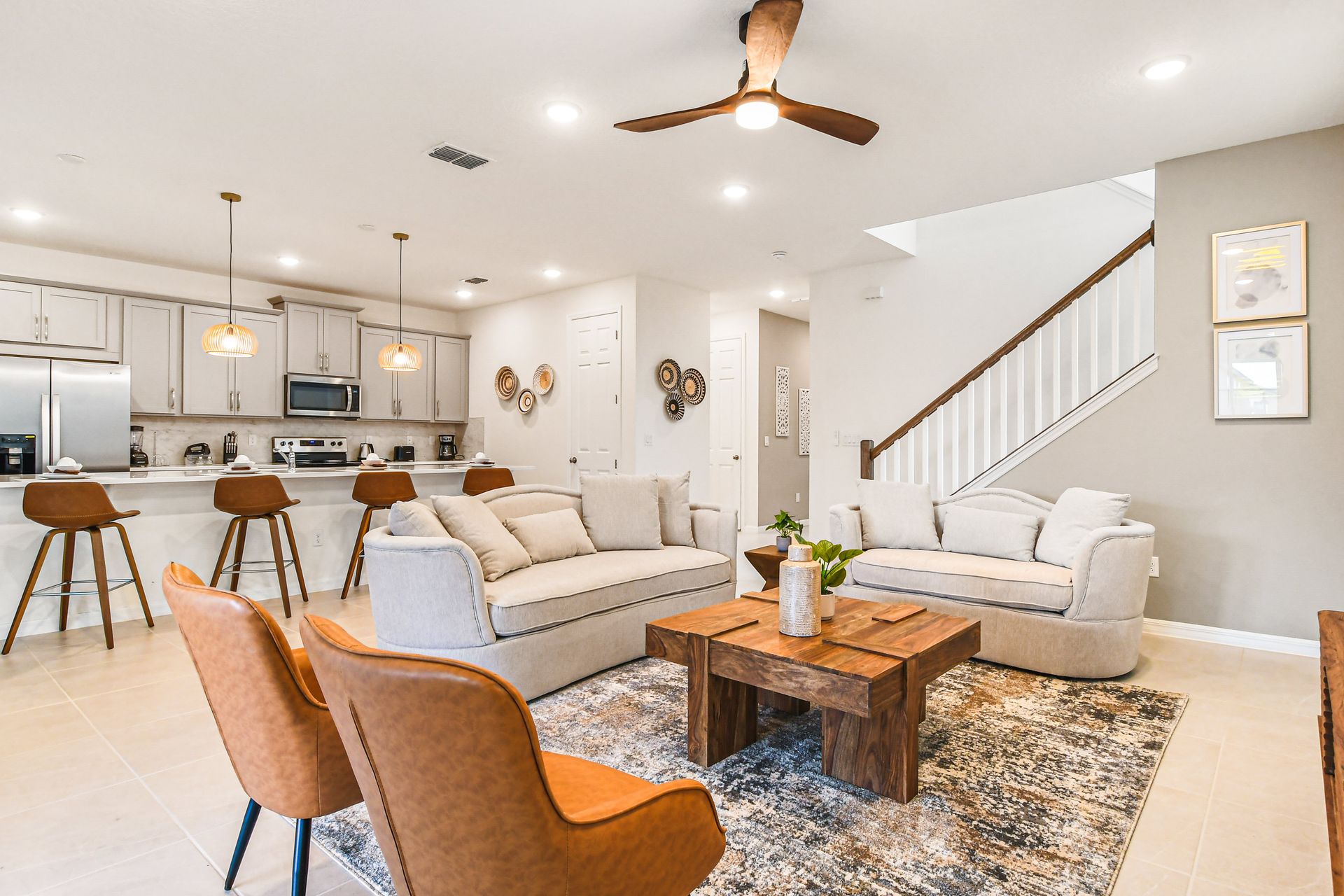 Spacious open-concept living with modern kitchen and stylish, cozy seating areas.