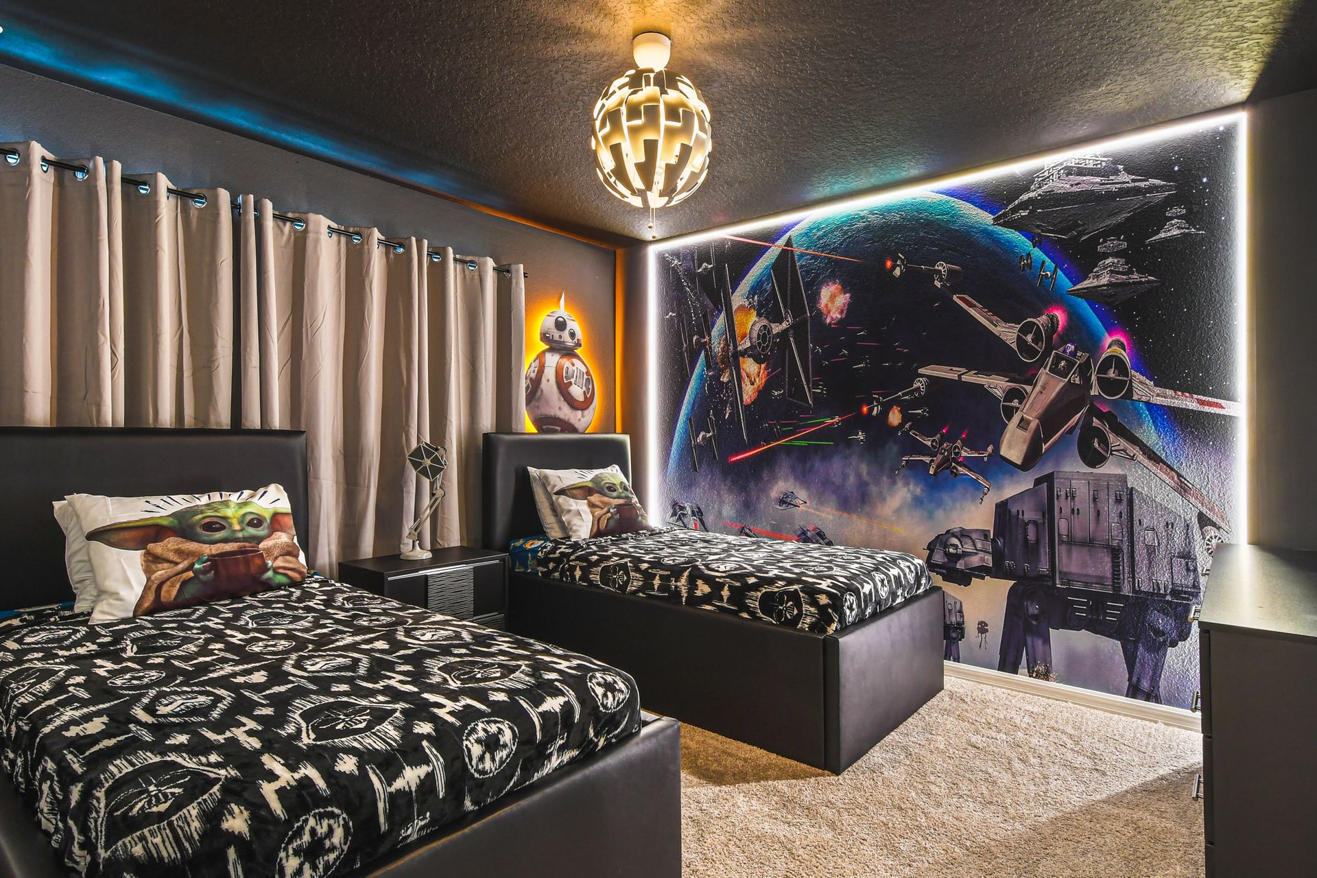 Star Wars twin room with galactic wall art, space lighting, and themed bedding.