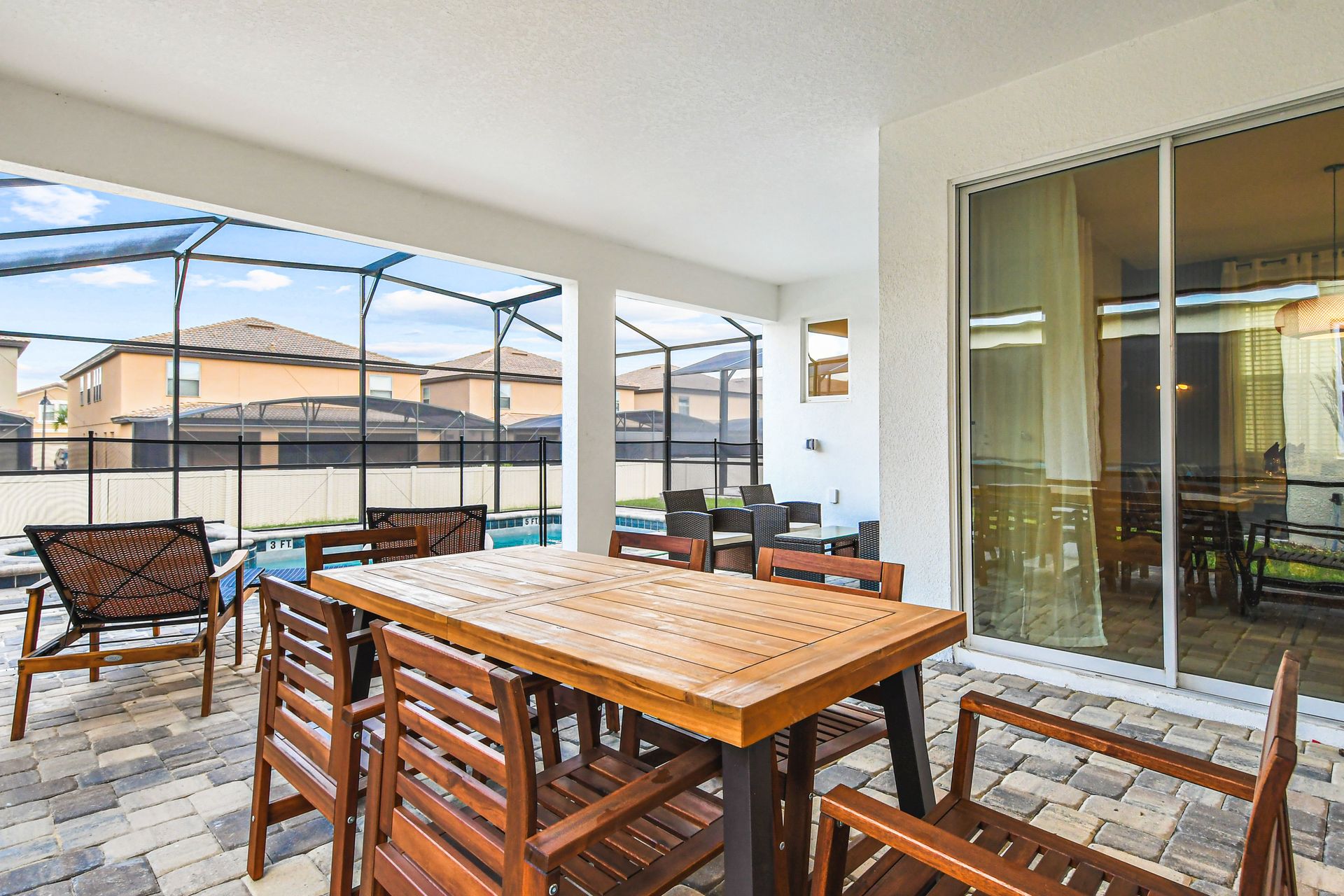 Enjoy outdoor dining and relaxation in your private screened poolside lanai retreat.