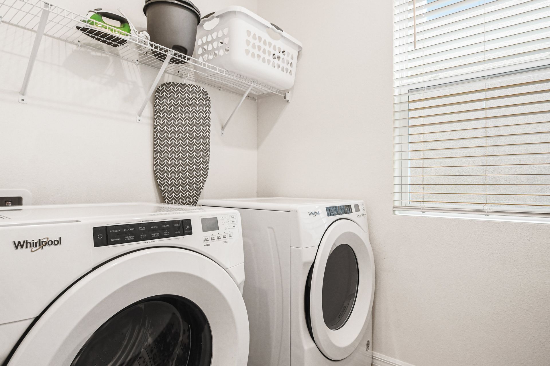 Keep clothes fresh and clean with the convenience of this bright laundry room.