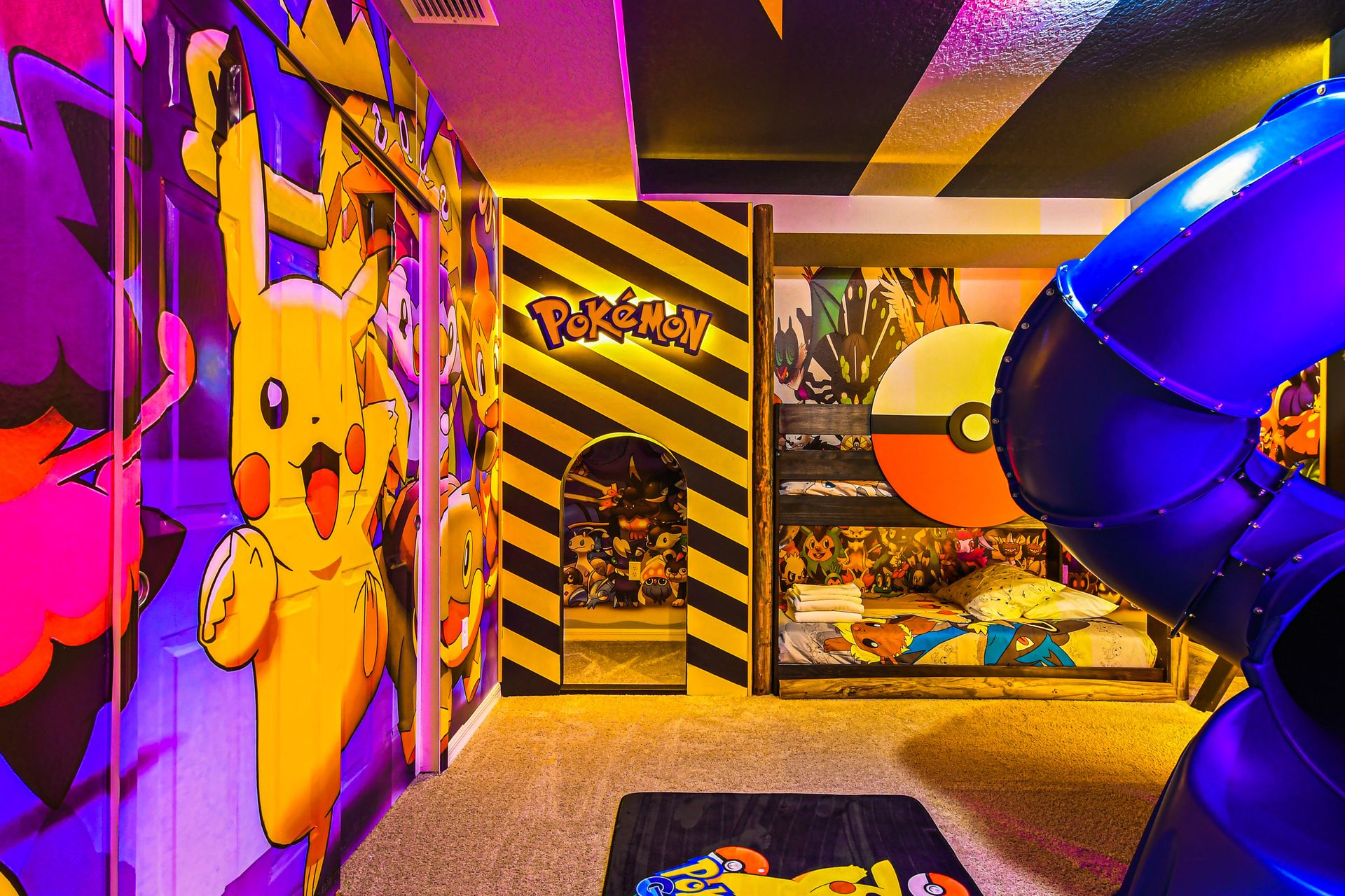 Vibrant Pokémon-themed room with bunk beds, slide, and immersive decor.