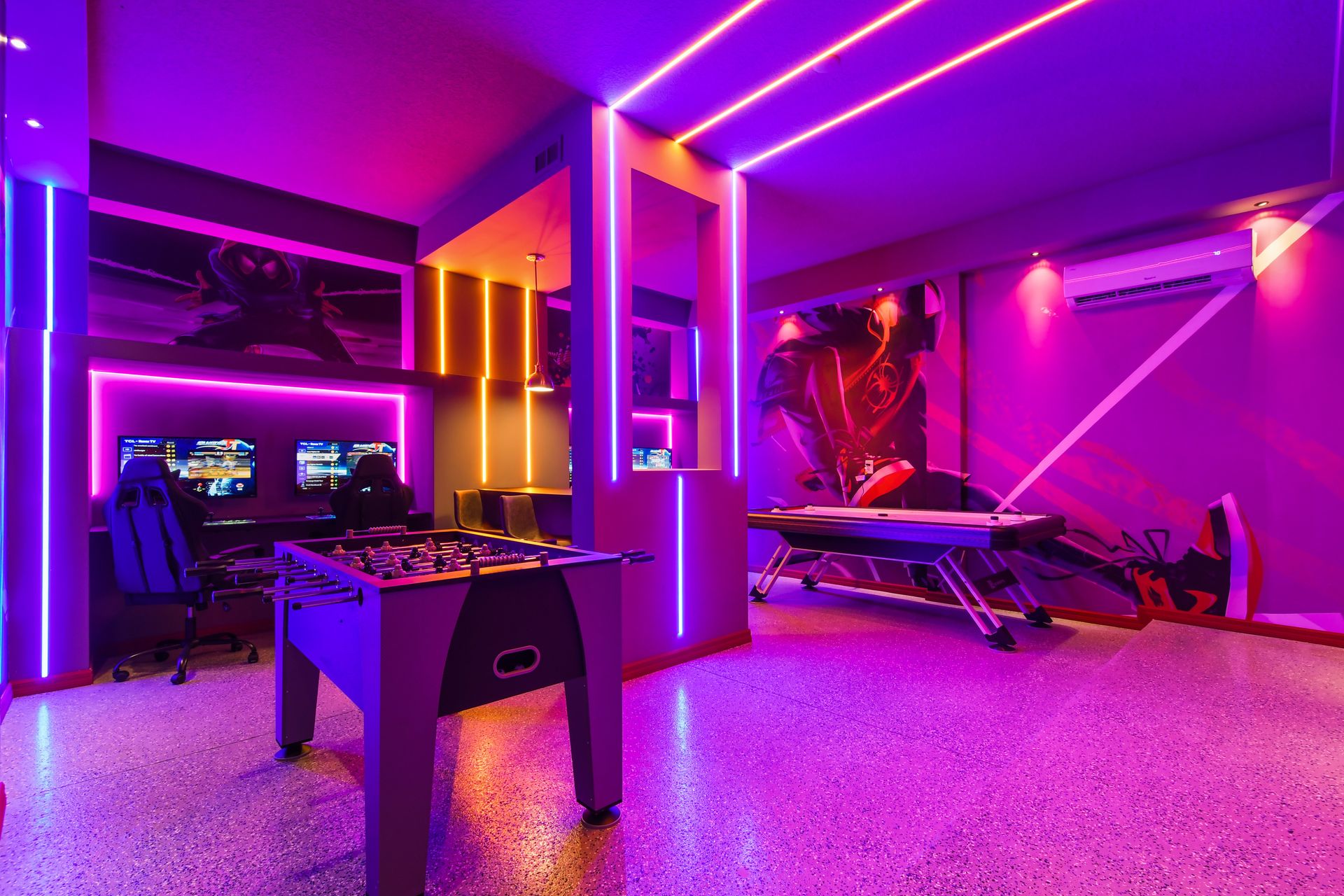 Vibrant game room with neon lighting, gaming stations, and arcade-style fun.
