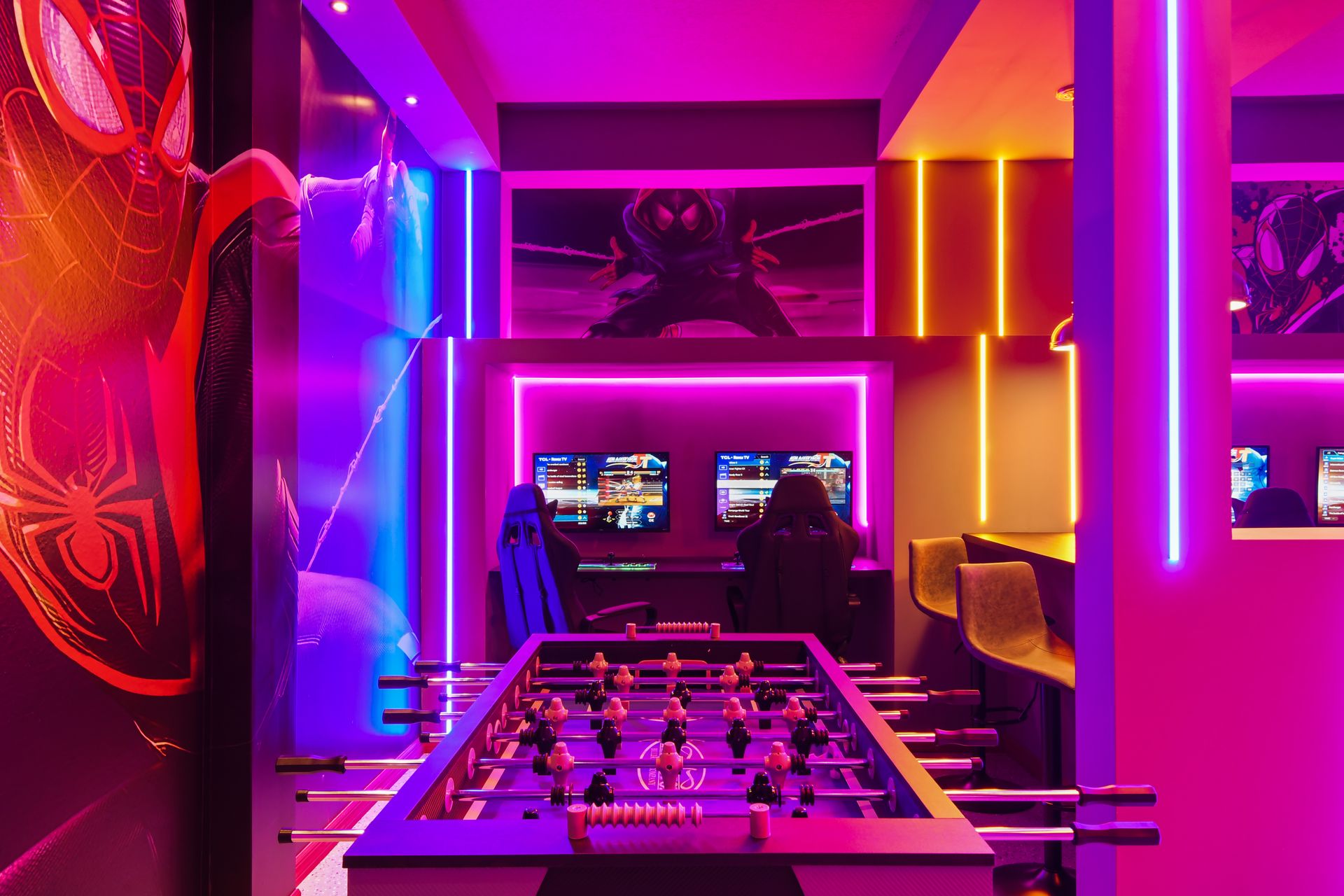 This vibrant and electrifying space features cutting - edge gaming stations and a foosball table, perfect for gamers looking for a thrilling and immersive environment.