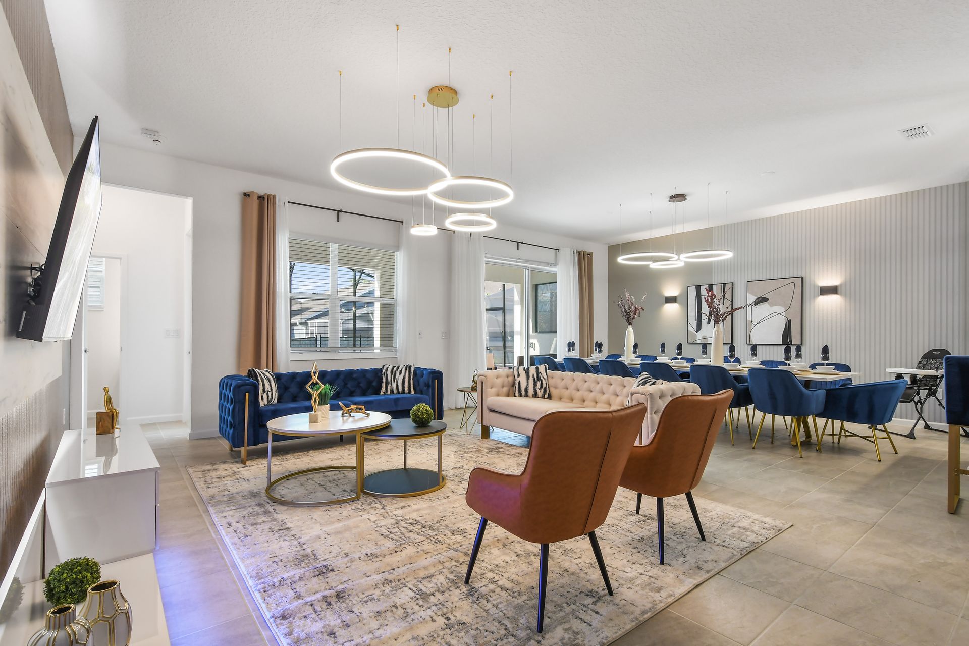 Spacious open-concept living and dining area with modern decor and seating.