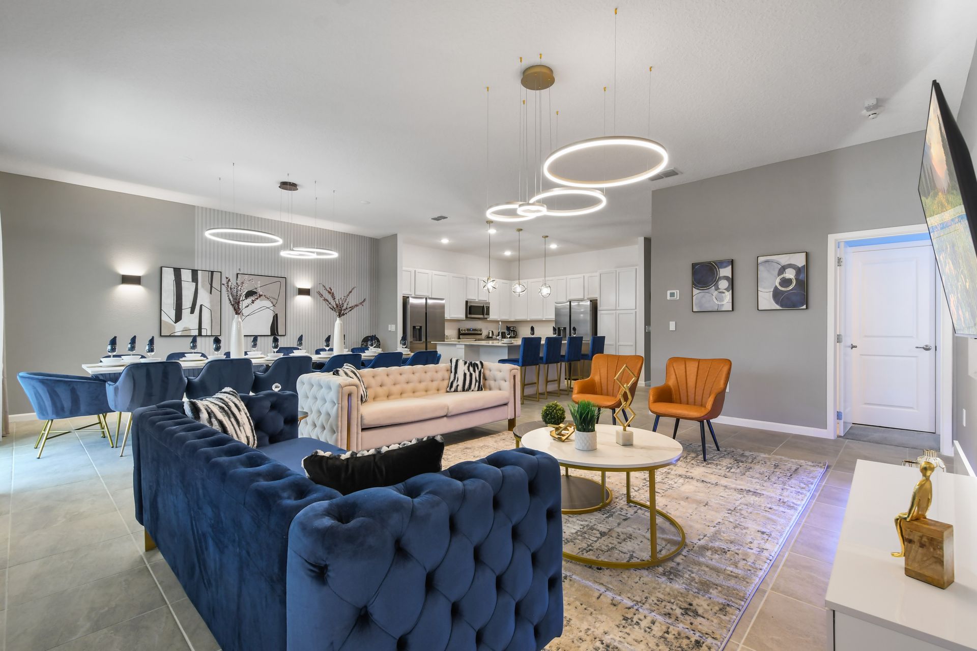 Spacious open-concept living and dining area with modern decor and seating.