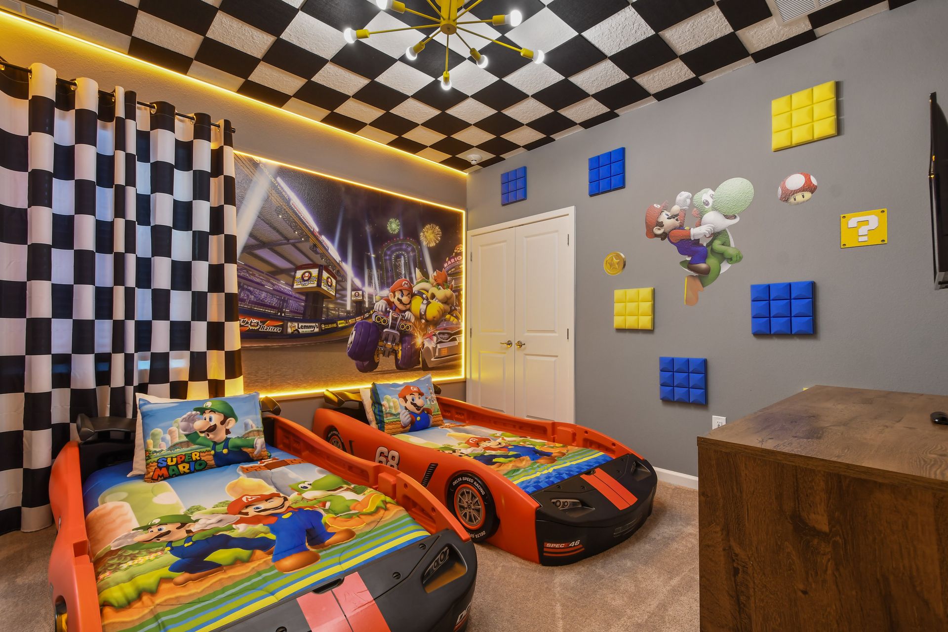 Get ready to zoom into fun in our Race Car Room. This dynamic space features race car beds for children.