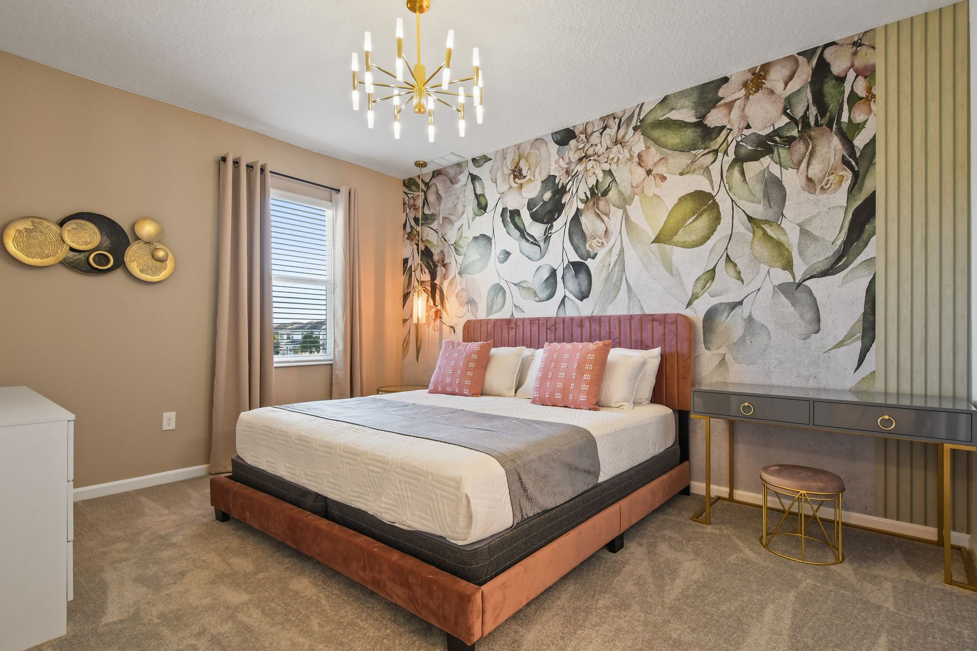 Floral-themed bedroom with soft tones, elegant lighting, and cozy seating.