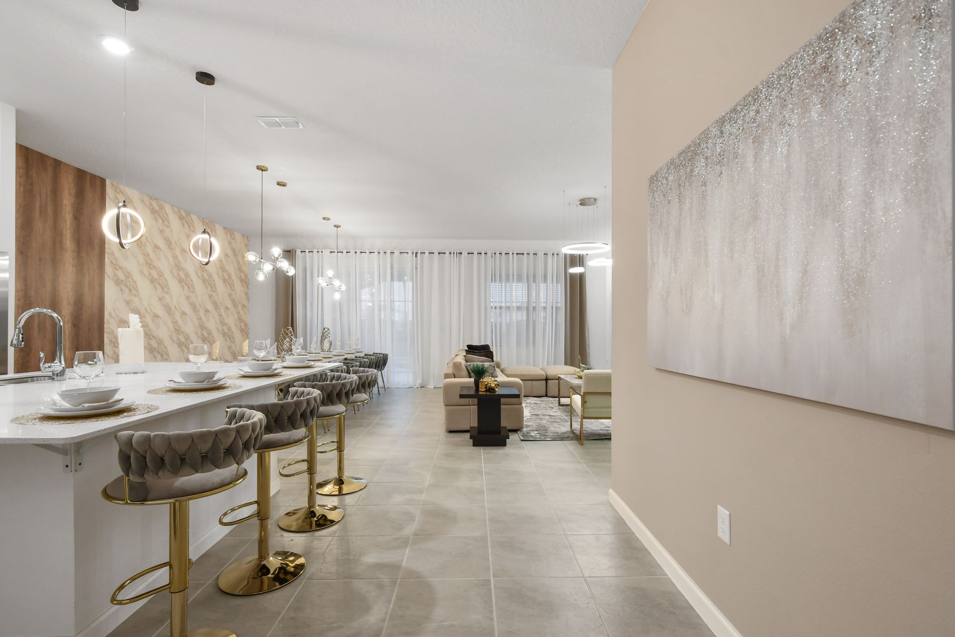 Sophisticated open-concept retreat with designer lighting and plush seating
