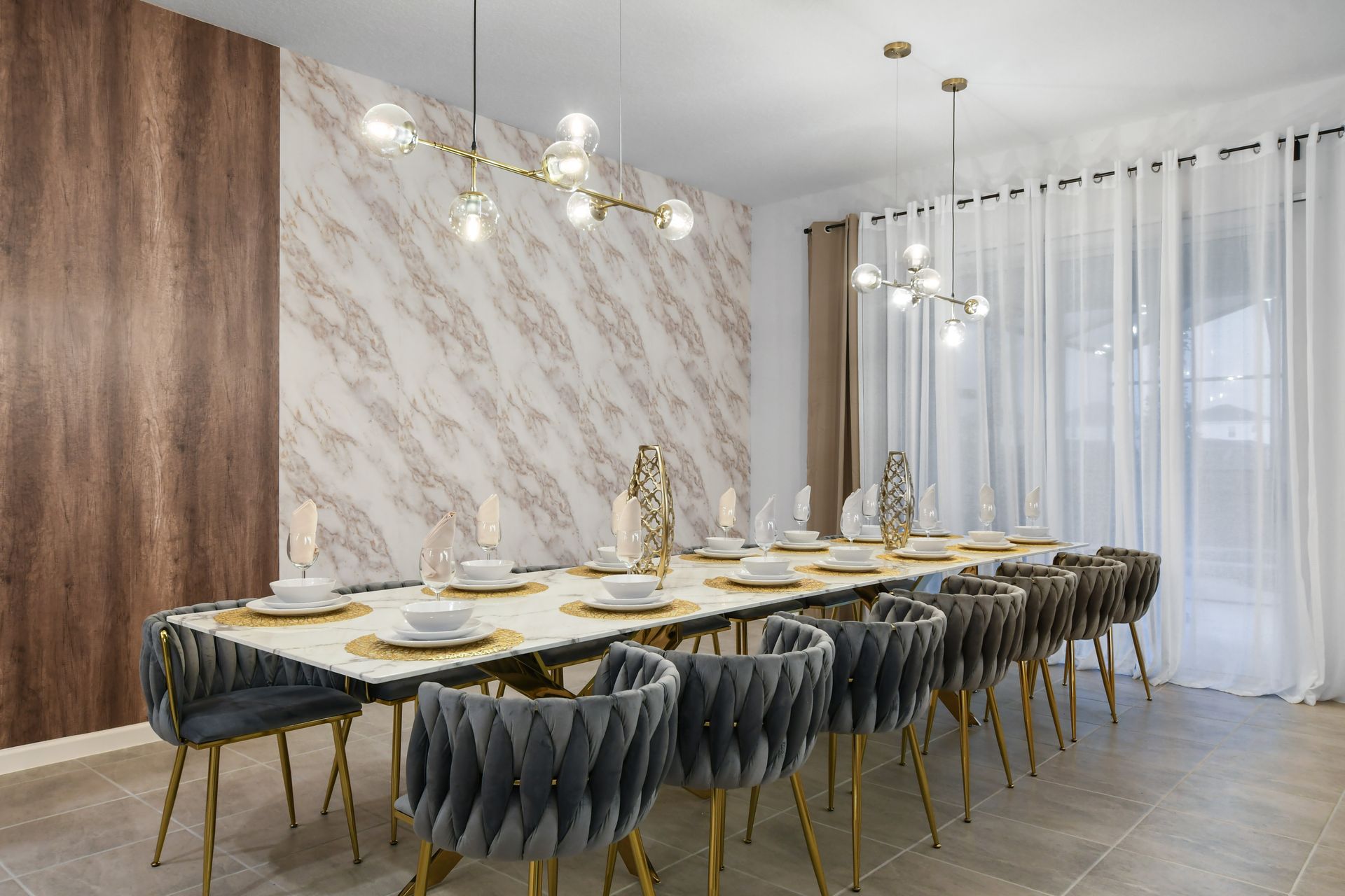 Host your family dinners or celebrations in this sophisticated dining room with seating for 14, beautifully designed with modern aesthetics and cozy lighting.
