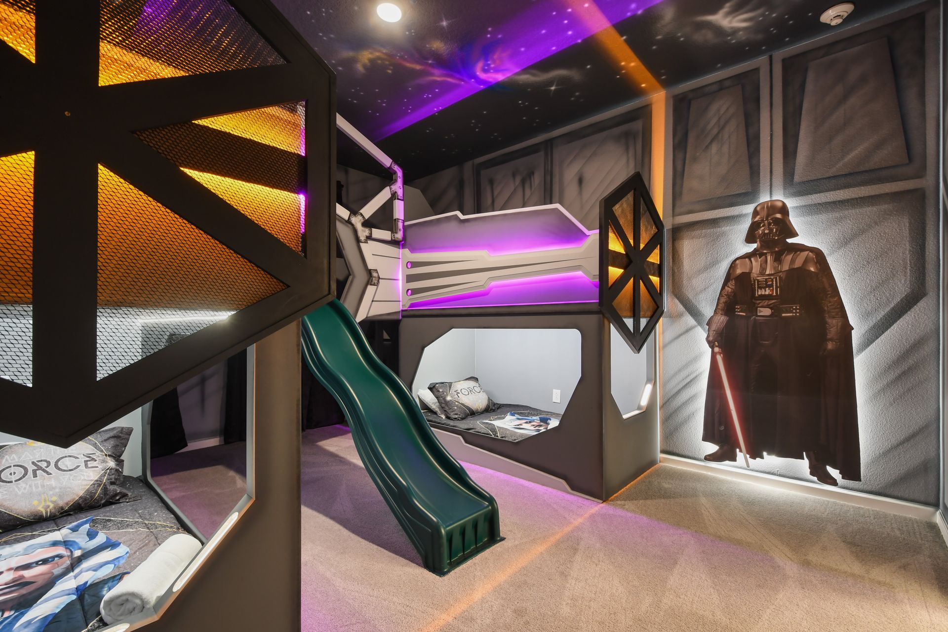 Epic Star Wars-themed kids room with bunk beds, galaxy lights, and slide fun
