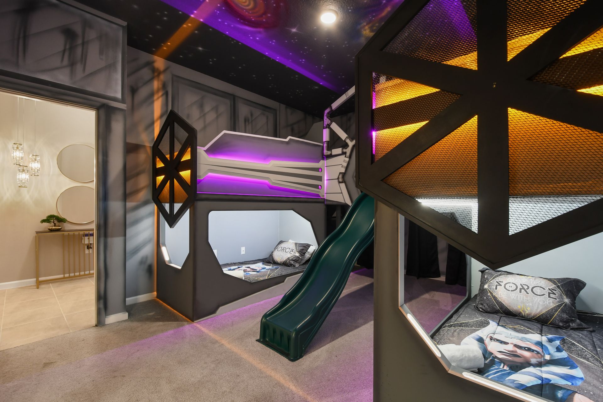 Epic Star Wars-themed kids room with bunk beds, galaxy lights, and slide fun
