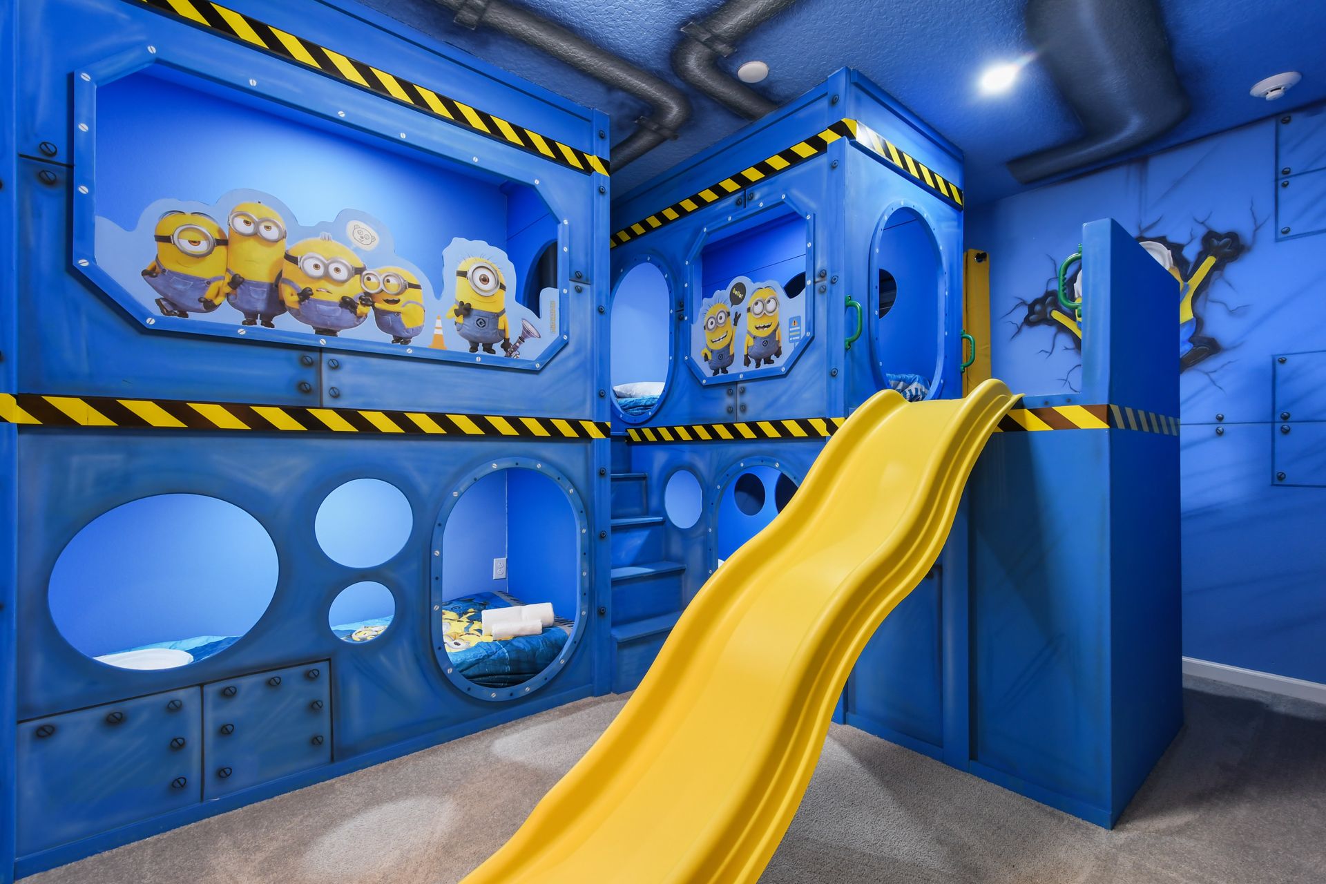 Minion-themed bunk room with slide, tunnels, and fun-filled adventure vibes
